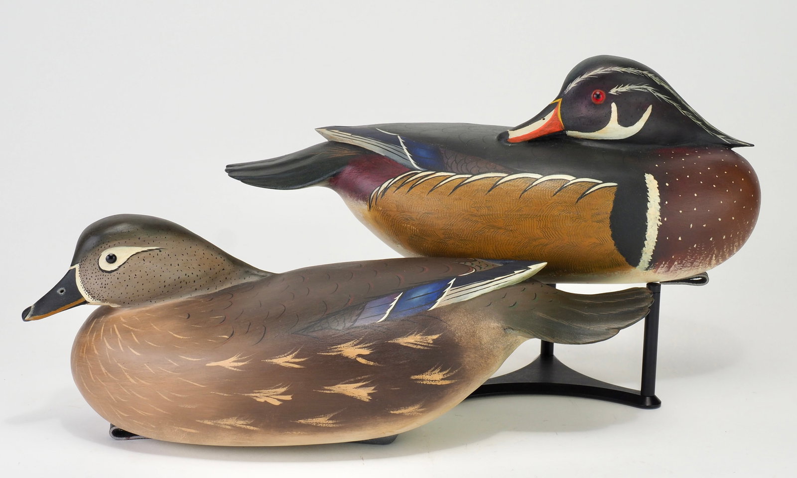 Bob White - Hollow Wood Duck Pair: Robert "Bob" White (b.1939) Tullytown, PA c.1999 Hen 15" Drake 14" Wood duck pair carved with a preening drake and resting hen. Large hollow carved bodies with flowing relief carved tails. The drake