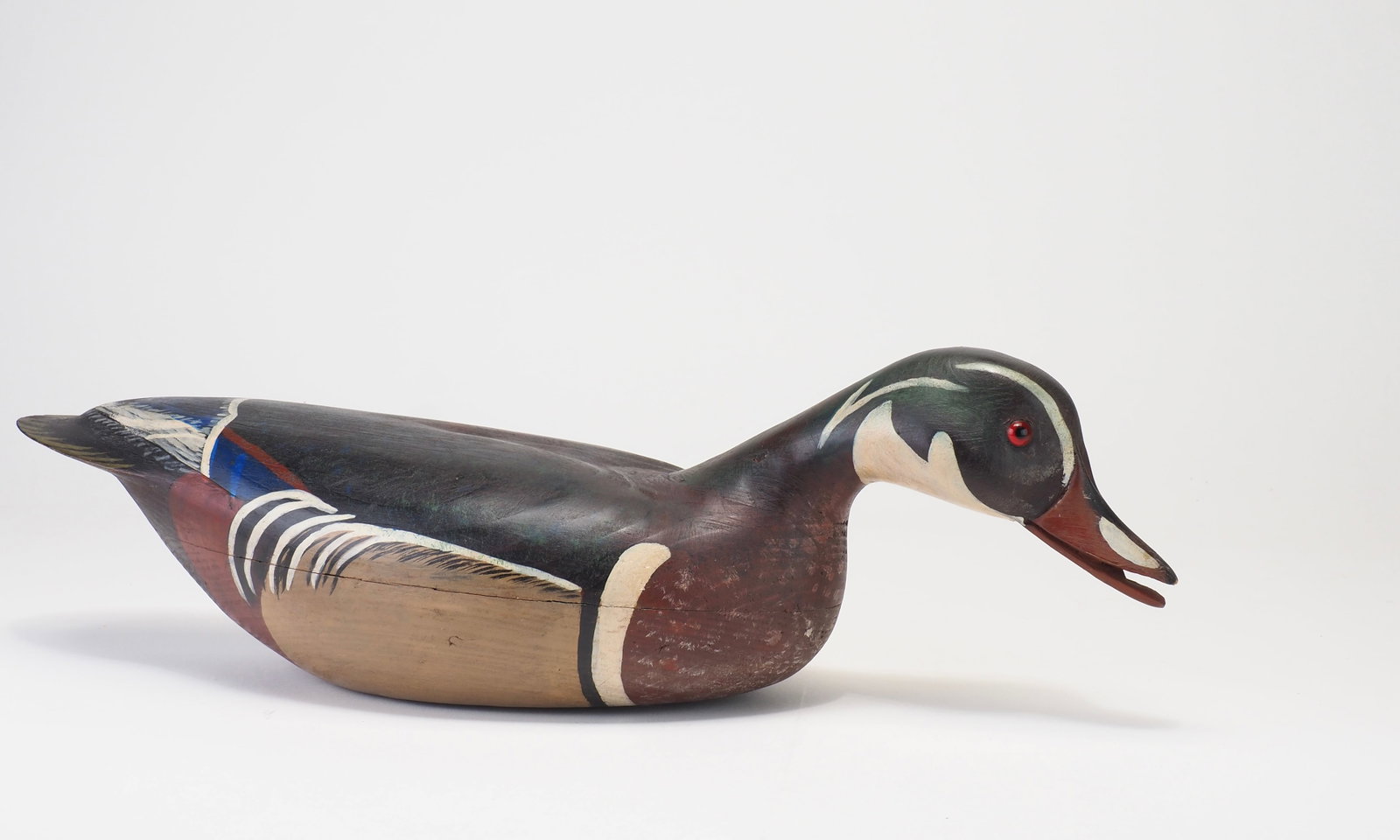 Hurley Conklin - Swimming Wood Duck Drake: Hurley Conklin (1913-1983) Manahawkin, NJ c.1950's 17" long Early pre-brand hollow carved decoy in a forward swimming position with a rare open mouth. The wing tip edges are slightly raised. Bears the