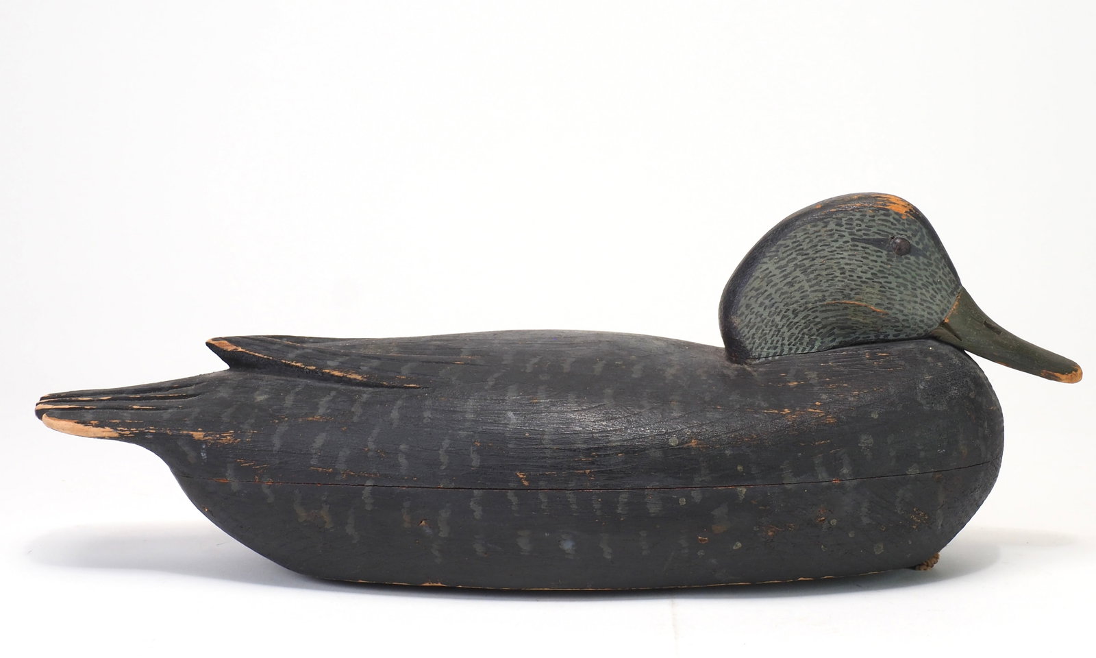 Tom Fitzpatrick - Black Duck: Thomas J. Fitzpatrick (1887-1958) Delanco, NJ 15.25" long Hollow carved with raised 'V' wing tips with incised primary feathering within. Relief carved tail feathers. Snuggle head with glass eyes and