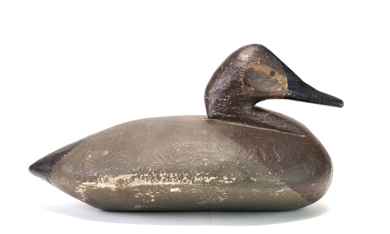 Walter Sellers - Canvasback Hen Nelson Manning Rig: Walter Sellers (1890-1969) Millersville, PA c.1930's 14" long | 7.5" wide Large bodied decoy in thick original paint. Bears the Nelson E. Manning (Millersville, PA) brass hunter tag on the underside.