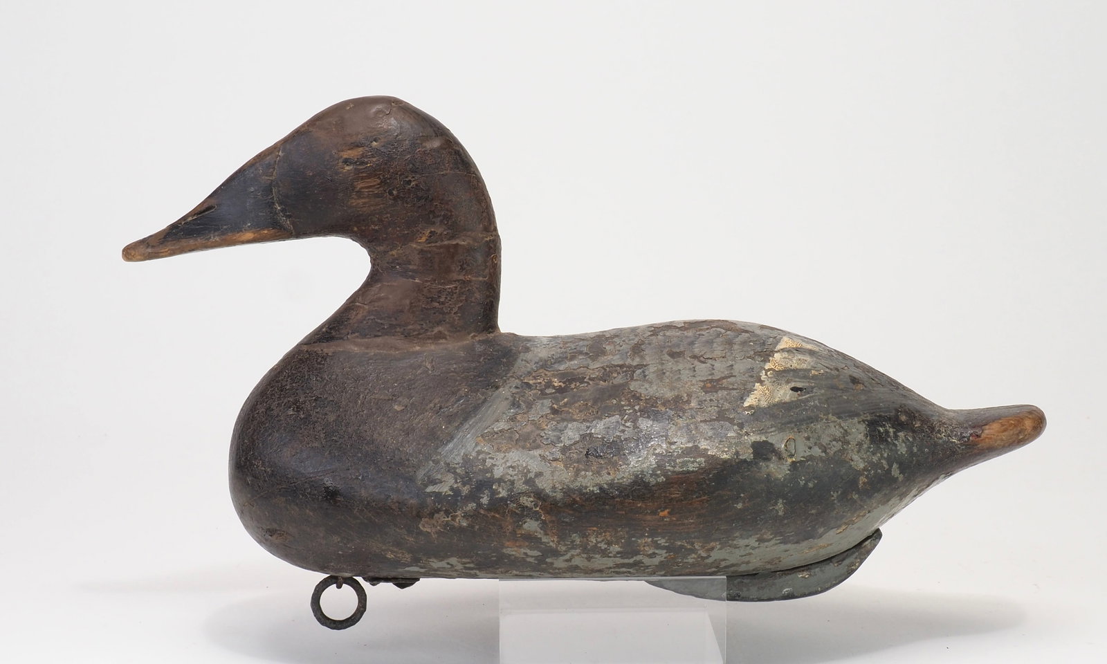 George Lockard - Petite Canvasback Hen: George Lockard (1866-1931) Elk Nelk, MD 12.5" long Condition: Various levels of old working paint, crack across the bill with various repair damage to the neck. Provenance: George Timmons collection