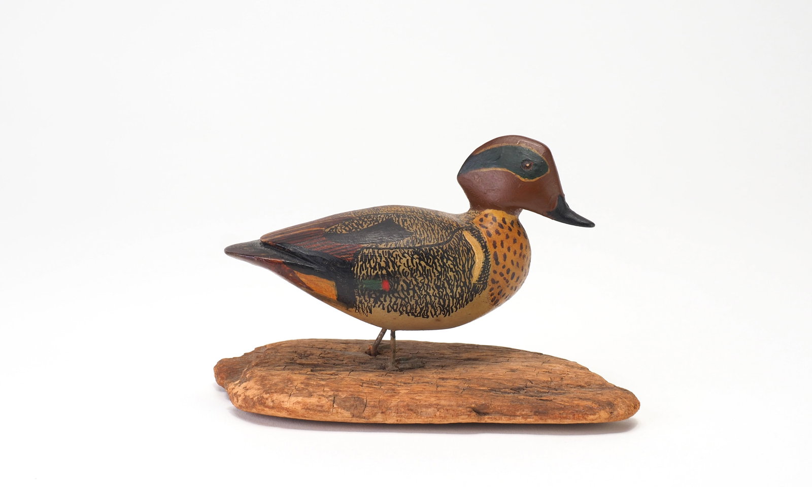 General Chester DeGavre - Greenwing Teal Drake: Brig. Gen. Chester "Chet" DeGavre (1908-1993) Onancock, VA bird is 3.75" long Shallow carved eyes with applied feet on base. Condition: Bird is excellent and original, feet are slightly loose where th