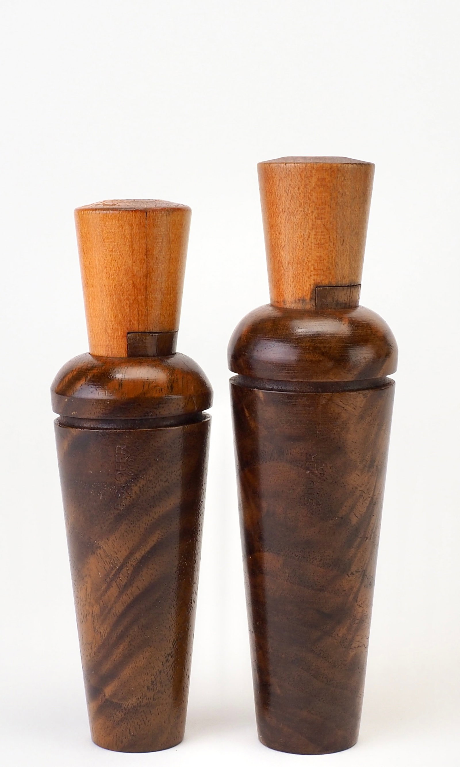 Two E.S. Stofer Burled Walnut Duck Calls: E.S. Stofer (1886-1958) Kansas City, MO 6" and 5.5" E. STOFER K.C. M.O stamped on side of both barrels. Both have matching numbered inserts and wedges, numbered 10 and 16 for the tall and short