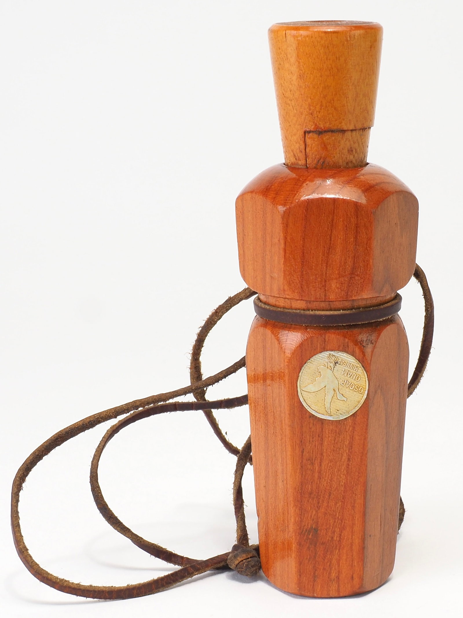 Oscar Quam - Medallion Duck Call: Oscar Quam (1887-1969) Minneapolis, MN 5.25" long Oscar Quam Minneapolis Medallion on side of barrel. Six sided barrel. Original lanyard. Condition: Very good and original with minor wear to mouth