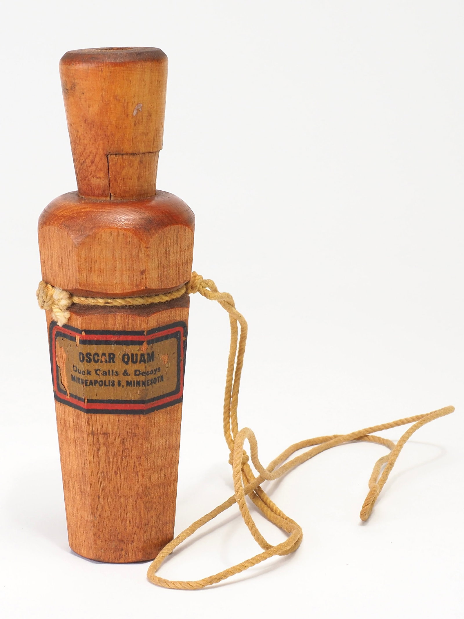 Oscar Quam - Octagon Barrel Duck Call: Oscar Quam (1887-1969) Minneapolis, MN 5.25" long Rectangular Oscar Quam graphic on side of barrel. Eight sided barrel. Condition: Good and original with light wear to barrel and insert. Light