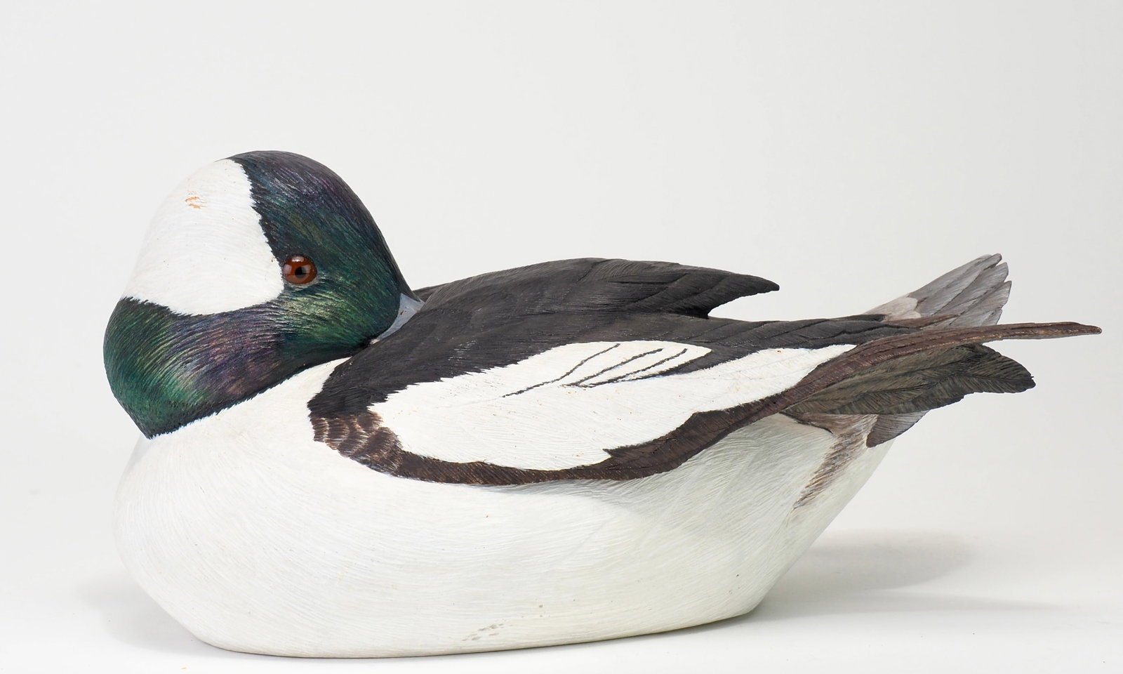 Len Carnaghi - Preening Bufflehead Drake: Len Carnaghi (1941-2023) Washington Township, MI 9.5" long Carnaghi was an avid collector and one of mid century Michigan's premier competition carvers. Hollow carved in an elaborate tucked head