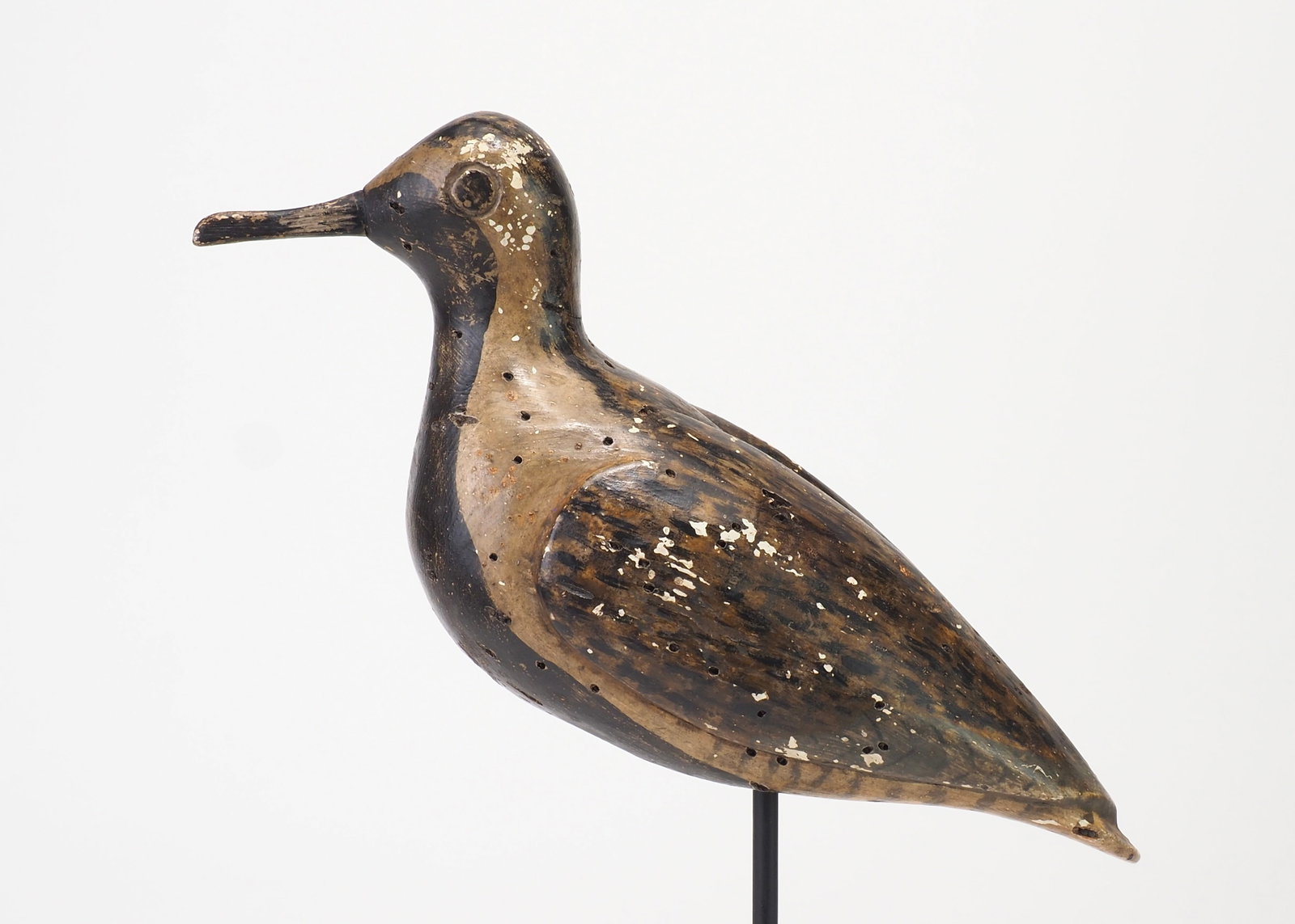 Henry Osbourne Attributed - Blackbellied Plover: Henry Osbourne attr. Bellmore, NY c.1890 11.5" long | 3.75" wide Plump wide bodied plover with deeply carved eyes and relief carved wings that come to an above the tail. Line loop hole drilled