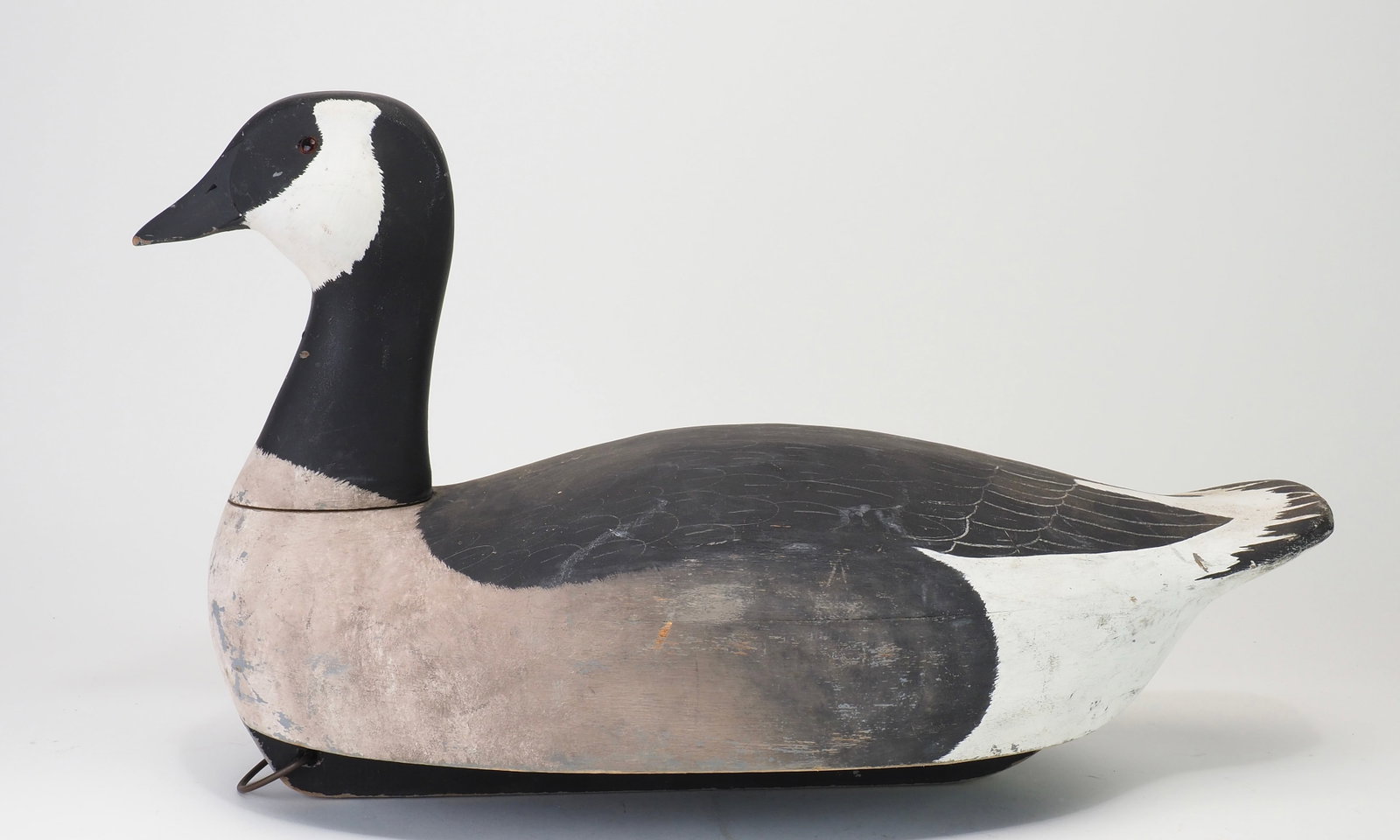 Ken Harris - Canada Goose Decoy: Ken Harris (1905-1981) Woodville, NY 21.5" Working goose decoy with glass eyes and incised bill details. Scratch feather painting on the back. White ink stamp in the bottom, the same stamp as on the b