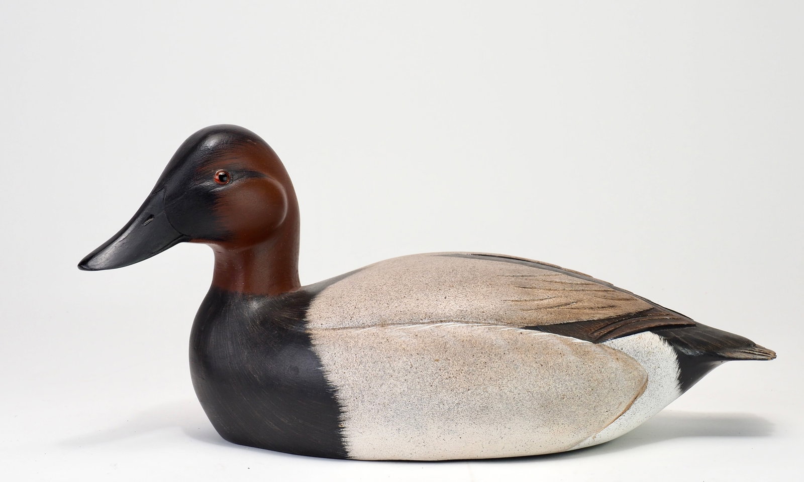 Ken Harris - Canvasback Drake: Ken Harris (1905-1981) Woodville, NY 14" long Well carved with sculpted wings and side pockets, carved primary feather and tail feathers. Head is turned to the left with glass eyes and incised bill