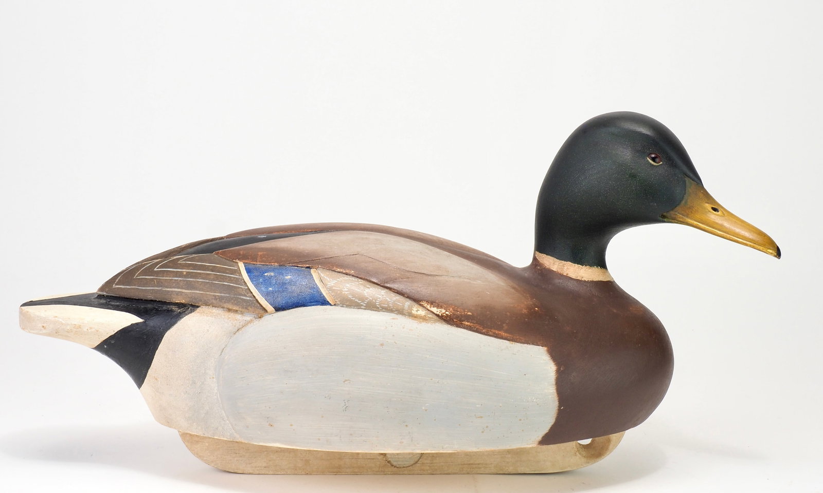 Bill Joeckel - Magnum Mallard Drake Personal Rig: William "Bill" Joeckel (1921-2010) Islip Terrace, Long Island, NY 18.5" long Hollow carved with a bold body and relief carved wings and side pockets. Bill Joeckel Decoys brand on bottom. In addition t