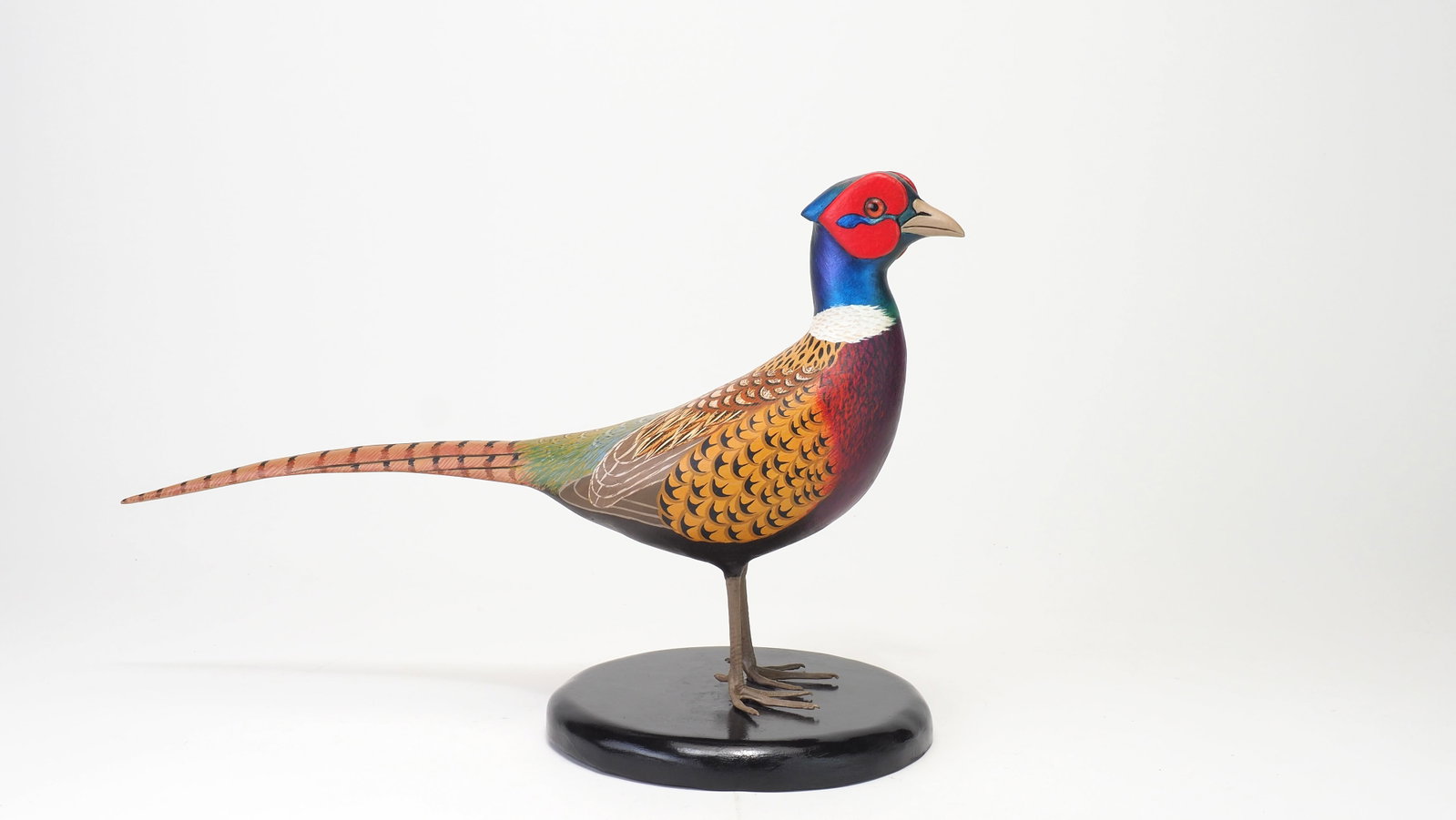John Wood - Pheasant: John "Jack" Wood Venice, FL 16" length x 10.5" height Signed on bottom Condition: Excellent and original, small paint loss to lower beak under berry. Provenance: Dennis Jenny Collection