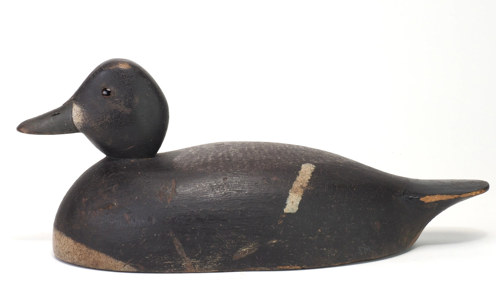 Robert Norman - Blue Bill Hen: Robert Anderson Norman Picton, Ontario, Canada 13.5" long Deep relief carving where the bill meets the face. Black glass eyes and stippled white paint across the back. R.A.N. / P. Painted on bottom