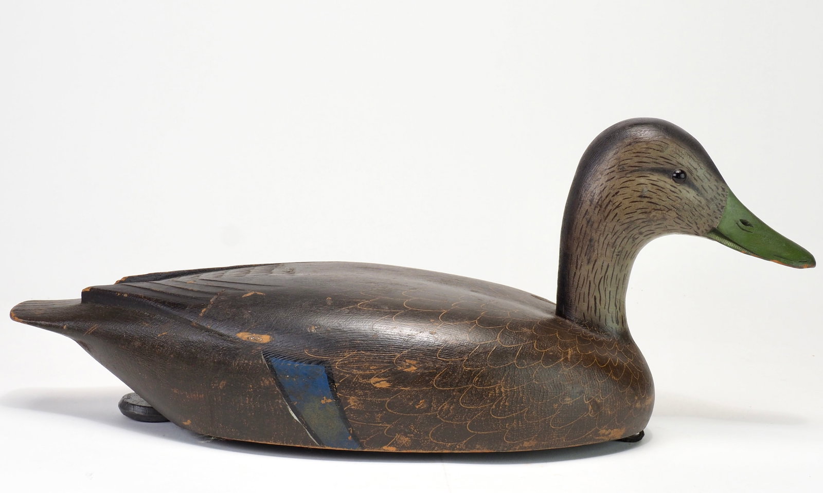 Davey Nichol - Black Duck: Davey W. Nichol (1890-1977) Smith Falls, Ontario, Canada 17.5" Working black duck with the original swing weight keel. Slender neck and elevated head with glass eyes and carved bill details. Scratch