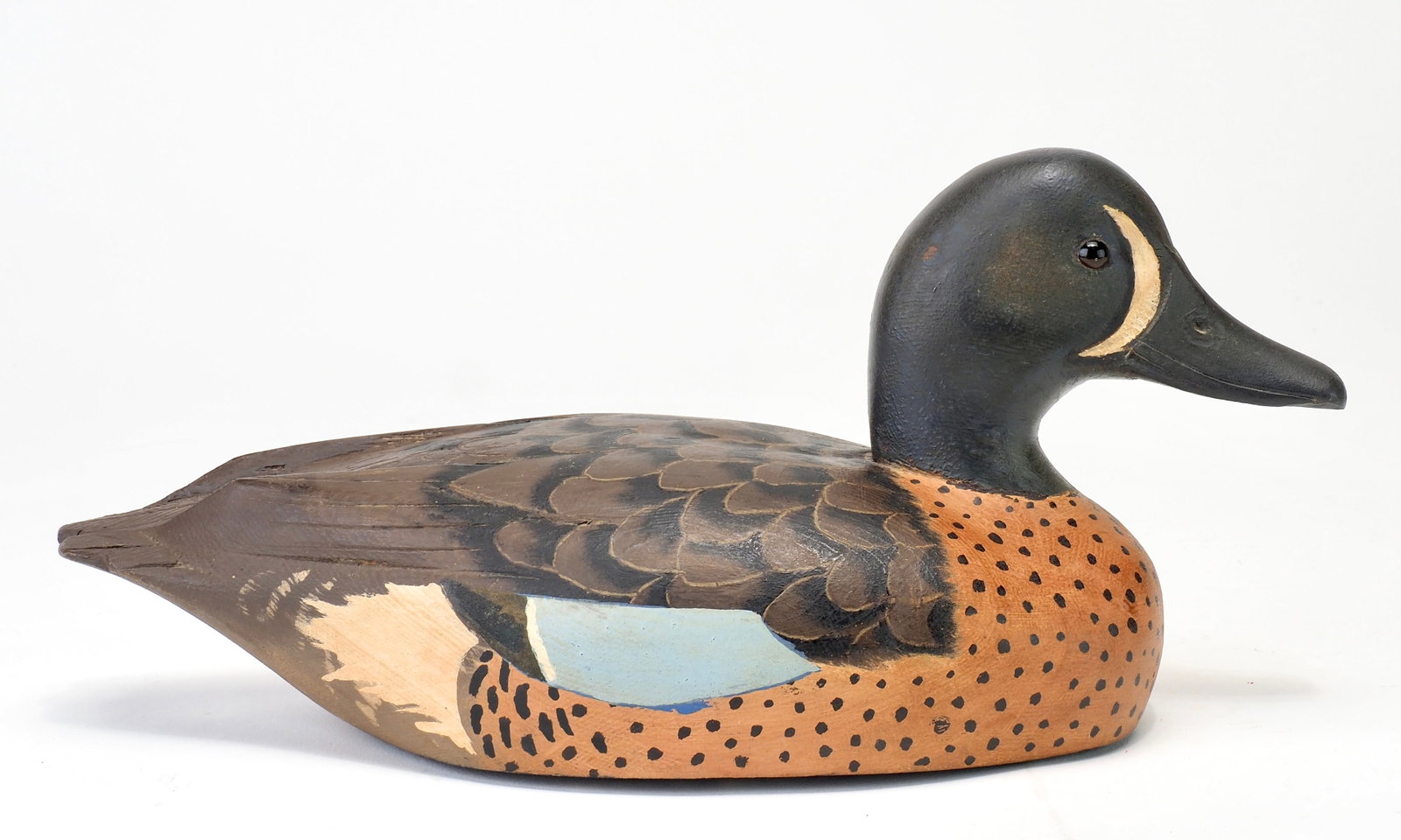 Davey Nichol - Bluewing Teal Drake: Davey W. Nichol (1890-1977) Smith Falls, Ontario, Canada 11" Vibrant paint with glass eyes and carved bill details. Raised wings with incising delineating feathering. Stamped loop feathering in the