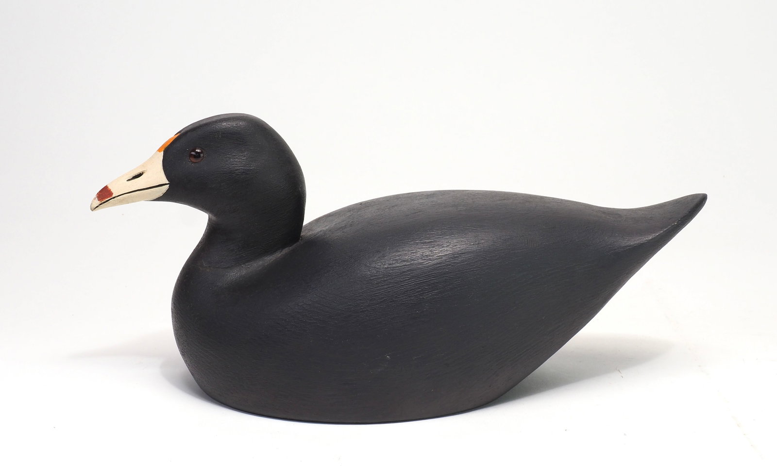 Ernie Fox - Coot: Ernie Fox (1925-1988) Brockville, ON 11.5" Rare species for maker. Glass eyes with carved beak. Branded E. FOX Condition: Very good and original, shallow dent in back, two small dents to right brow.