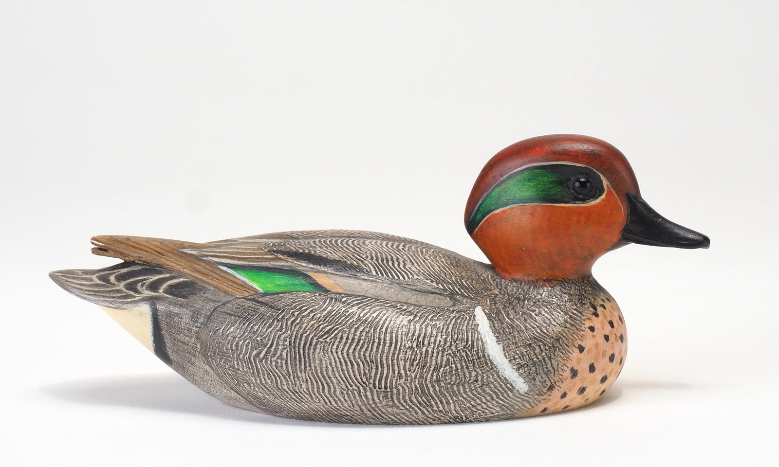 Bob Kerr - Miniature Greenwing Teal Drake: Robert G. Kerr (1935-2025) Smith Falls, Ontario, Canada 5" Tight comb feather paint with raised and crossed wing tips. Tiny glass eyes and carved bill detail. Signed and dated Jan 1976 for George
