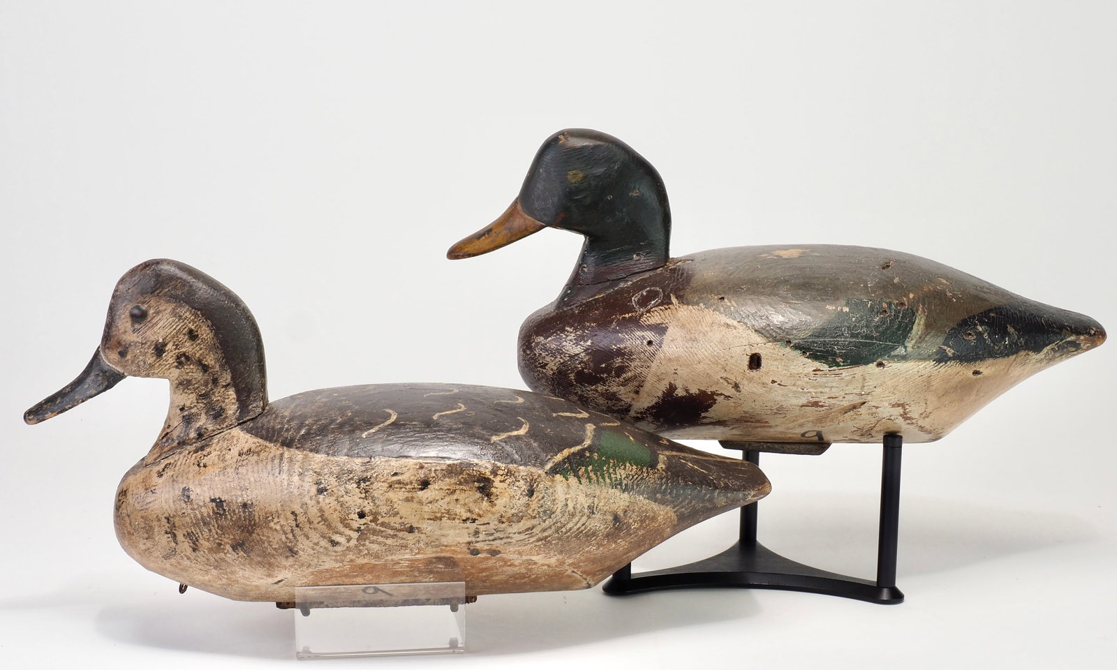 Elmer Wolf - Mallard Pair: Elmer Wolf (1893-1930) Port Clinton, OH c. 1911 13.5" each Winous Point Shooting Club mallard pair. Large bodies with applied heads and deep relief carving where the face meets the bills. The hen has