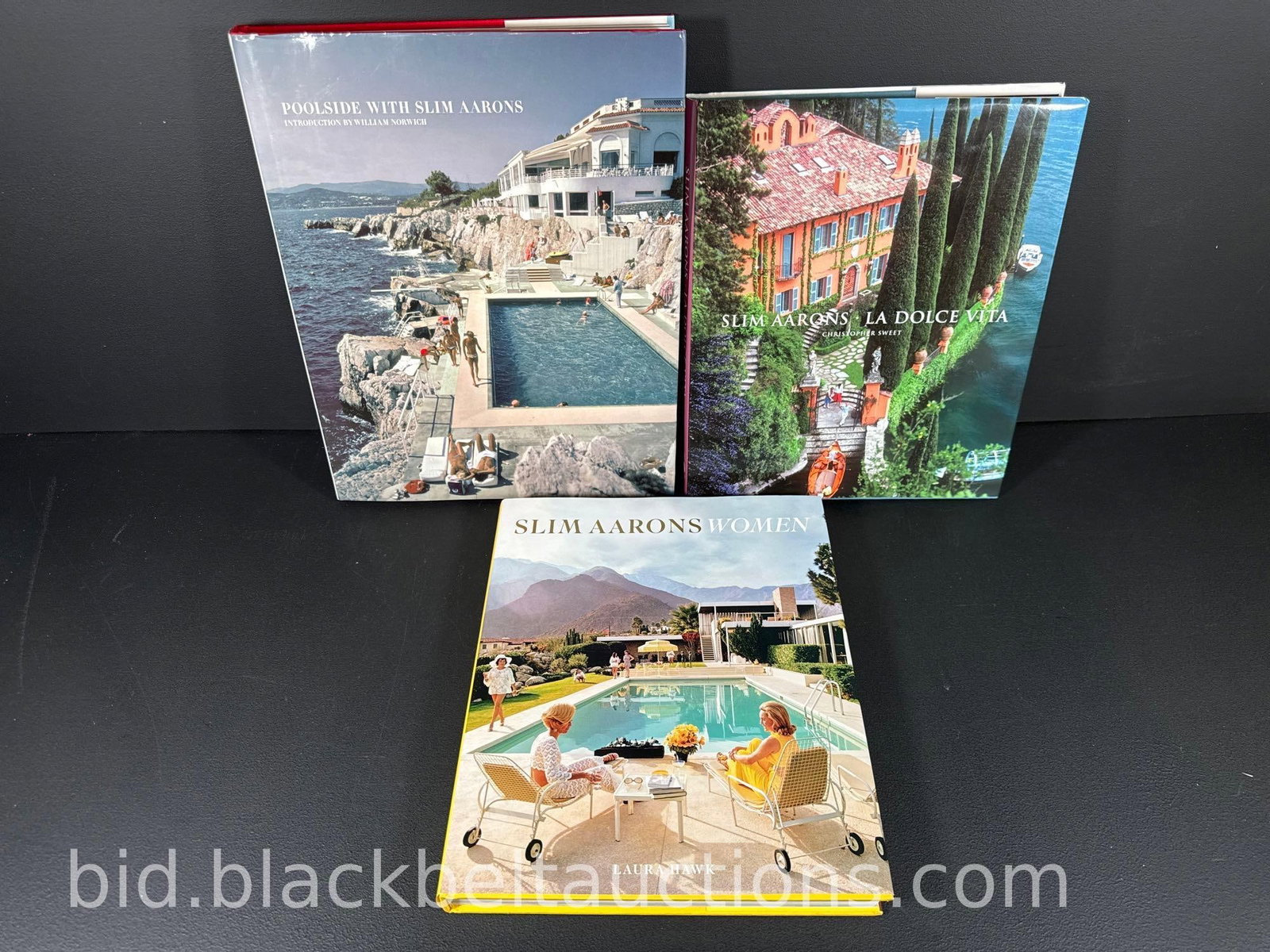 Three Slim Aarons Books: Three Slim Aarons Books to include: ”Poolside with Slim Aarons” Twelfth Printing 2007 ”Slim Aarons - Women” with Laura Hawk Fifth Printing 2016 ”Slim Aarons - La Dolce Vi