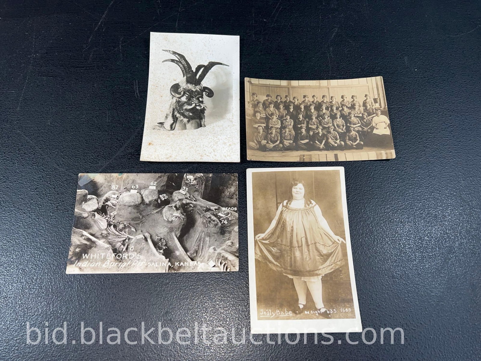 Four Vintage Real Photo Post Cards: Four vintage real photo post cards regarding people to include a person in a Krampus mask, a group photo of an unidentified class of women, “Jolly Babe” a 635 pound woman and remains in an