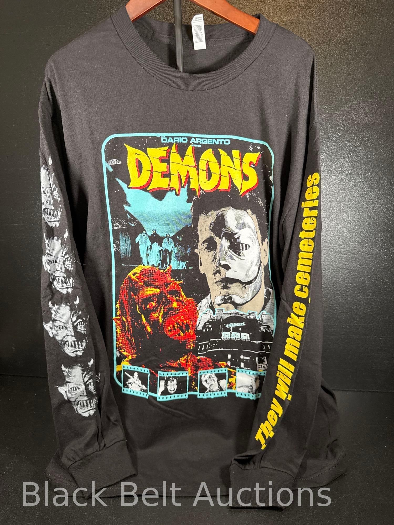 Demons Long Sleeve T-Shirt: Lot description: A Dario Argento Demons size large, long sleeve t-shirt, double sided. Note: T-Shirts are estate finds and are sold as-is. We do not wash clothing. Clothing may have been exposed