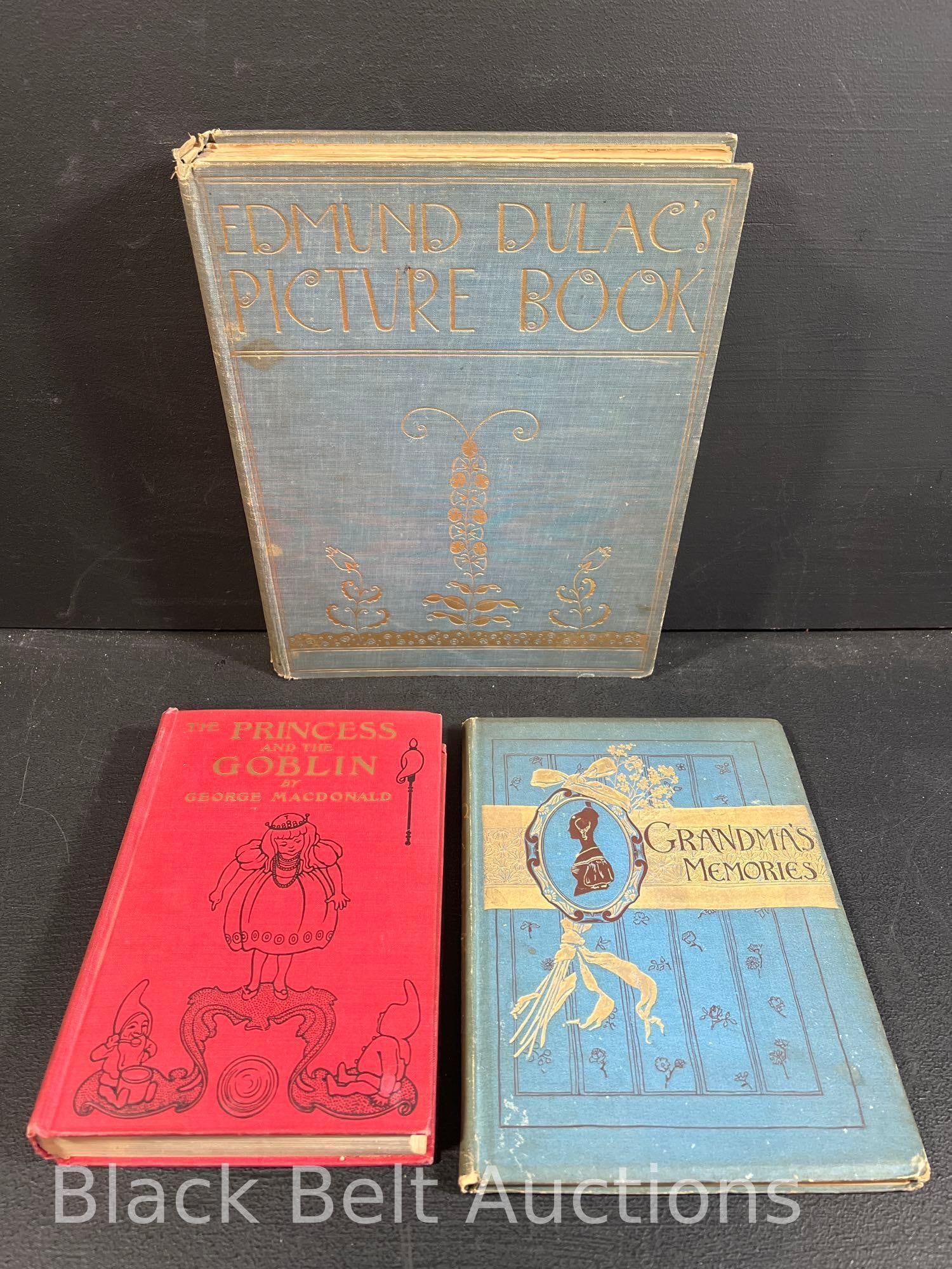Three Edwardian Era Books: Lot description: Three Edwardian era books to include: Edmund Dulac's Picture Book published c.1920 by Hodder and Stoughton Ltd. Blue cloth bound with gilt embossed lettering and design on both the sp