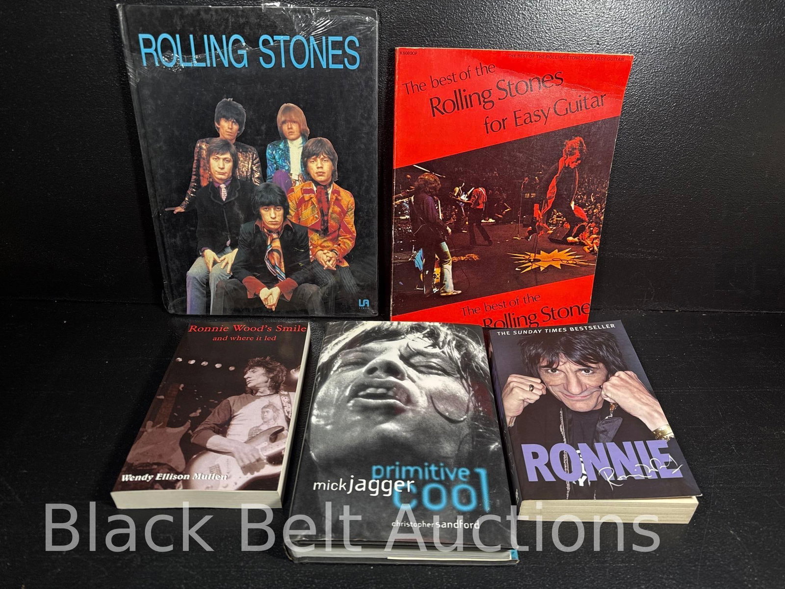 5 Books on The Rolling Stones: Lot description: To include a Libsa book on The Rolling Stones (Book is in a foreign language and has shrink wrap that is falling apart in several places, “The best of The Rolling Stones for Eas