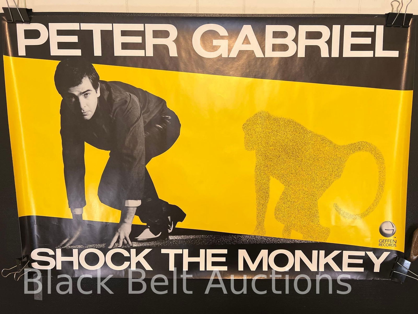 Peter Gabriel “Shock the Monkey” Poster: Lot description: Vintage 1982 Geffen Records promotional poster for Peter Gabriel’s “Shock the Monkey”. The poster measures 23 inches x 35 inches. The poster has some creasing