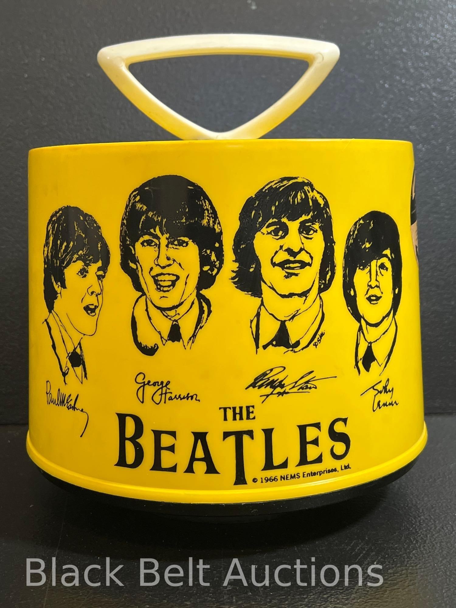 Vintage Yellow Beatles Disc-Go-Case Record Case: Lot description: Vintage original Beatles yellow Disc-Go-Case 45 rpm record storage case. It measures 9 inches high and 8 inches in diameter. The case has been used - there are visible smudge marks