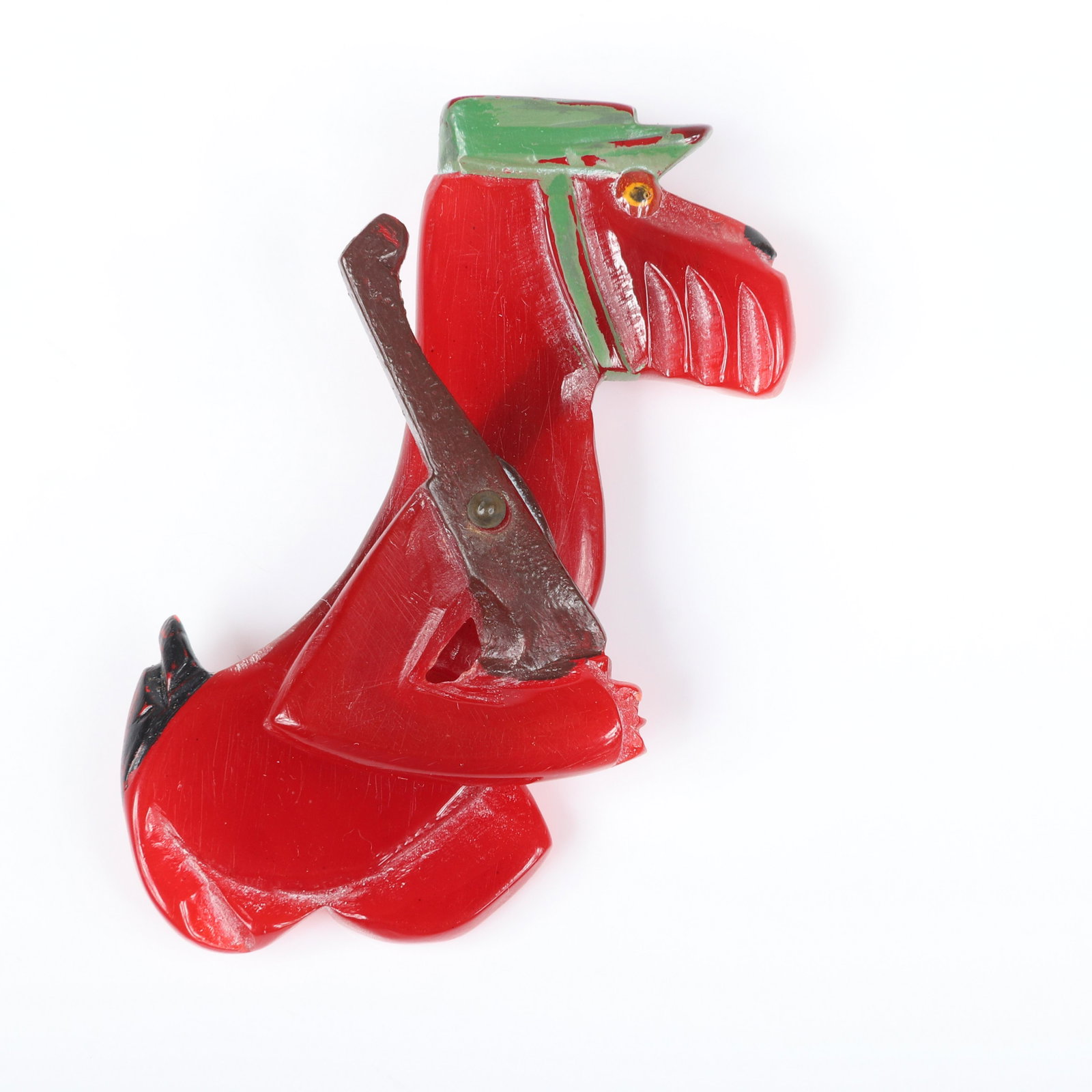 Figural bakelite carved and painted Military dog: Figural bakelite carved and painted Military dog soldier pin with articulated arm and gun. 3"H x 1 1/2"W (dog)