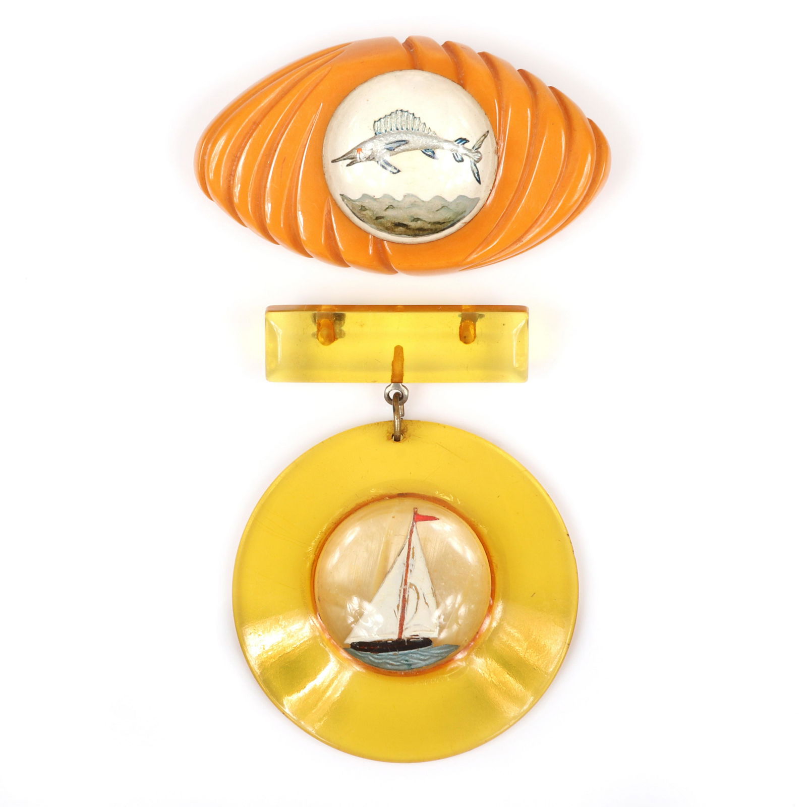 Two ocean themed Bakelite pins with domed clear (1 of 4)