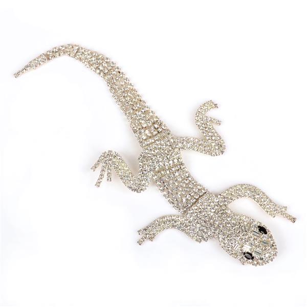 Butler and Wilson articulated diamante shoulder lizard: Butler and Wilson articulated diamante shoulder lizard pin with blue sapphire glass marquise eyes. 3" x 7 1/2"