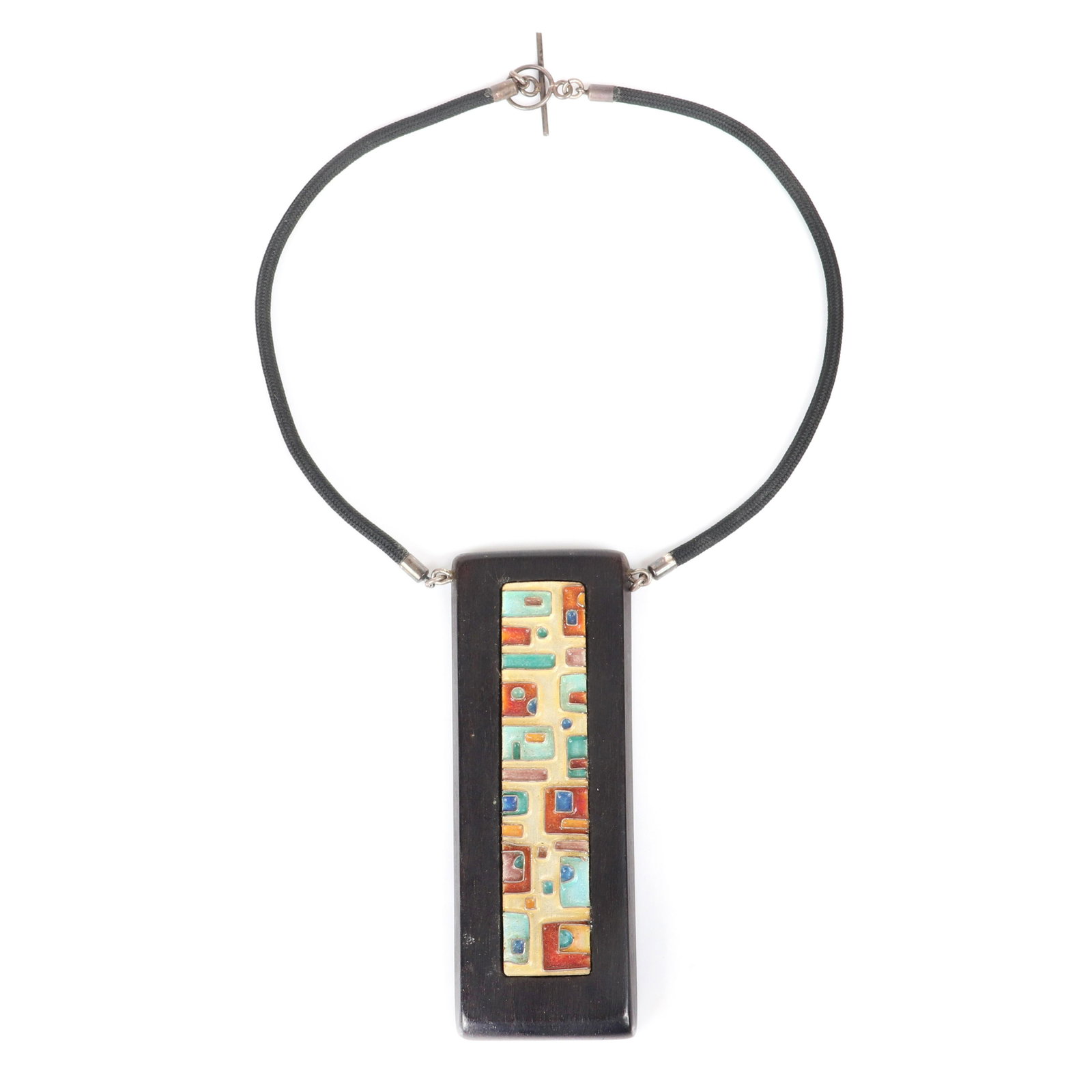 Mildred Ball American Modernist large wood pendant with: Mildred Ball American Modernist large wood pendant with inlaid blue and rust enamel geometric square panel on woven black cord. 13"L (necklace), 3 3/4"H x 1 1/4"W (pendant)