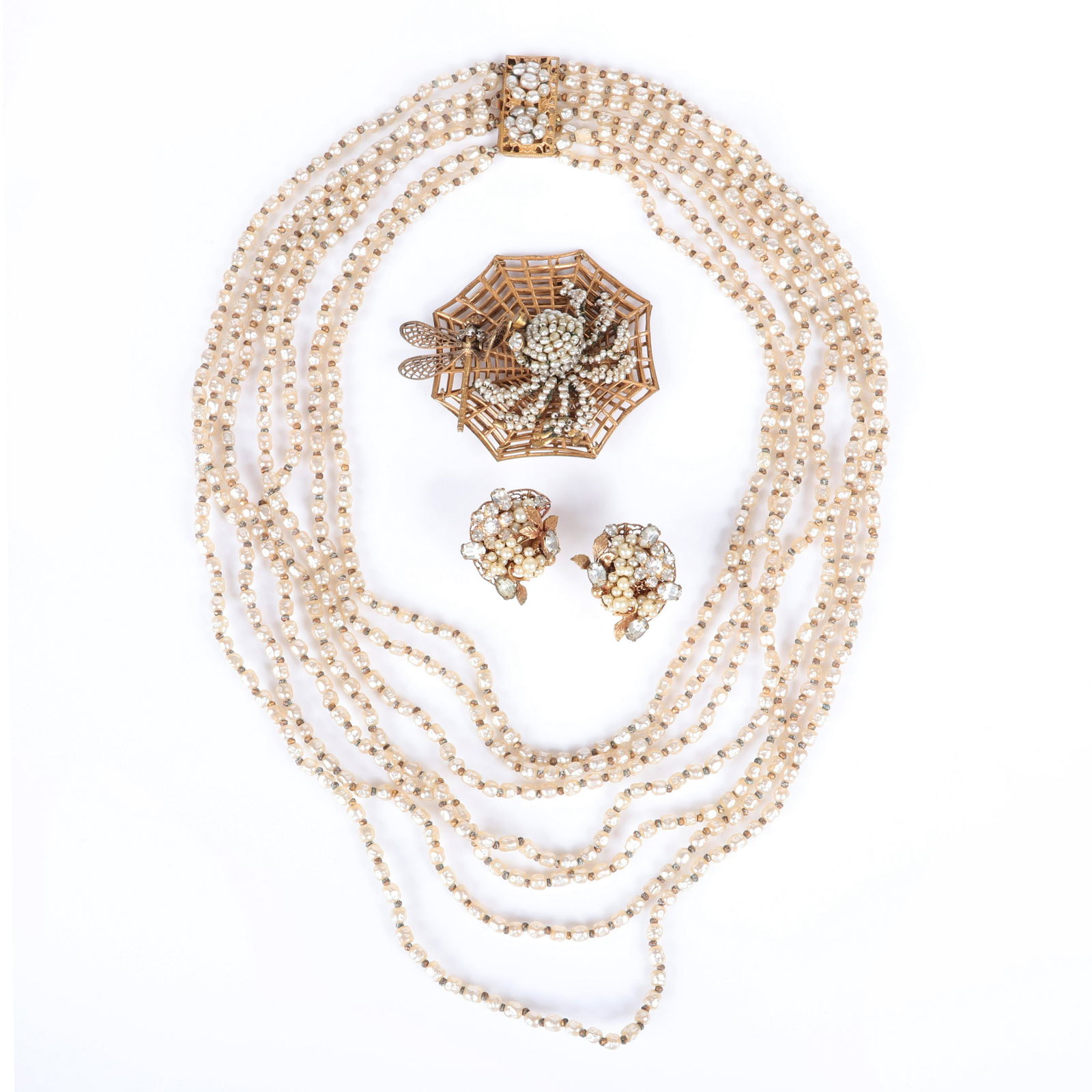 Miriam Haskell seven graduated strand faux pearl: Miriam Haskell seven graduated strand faux pearl necklace, large figural openwork spider web and dragonfly brooch, Robert faux pearl and rhinestone earrings. 15"L (necklace)