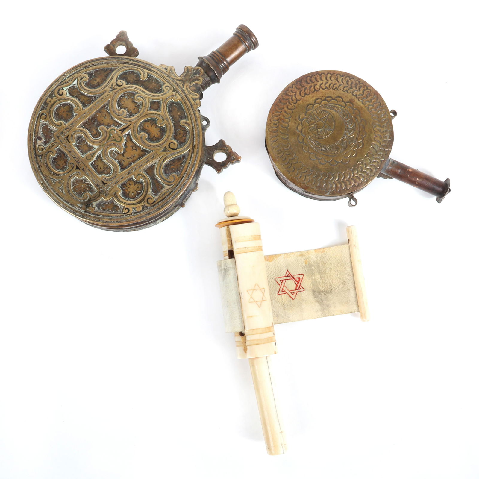 Three pc group: Judaica carved bone housing for a: Three pc group: Judaica carved bone housing for a Megillah hide scroll with etched Star of David and two middle Eastern ornate brass powder flasks., 7 1/2"H x 5 1/2"W x 2"D (largest)