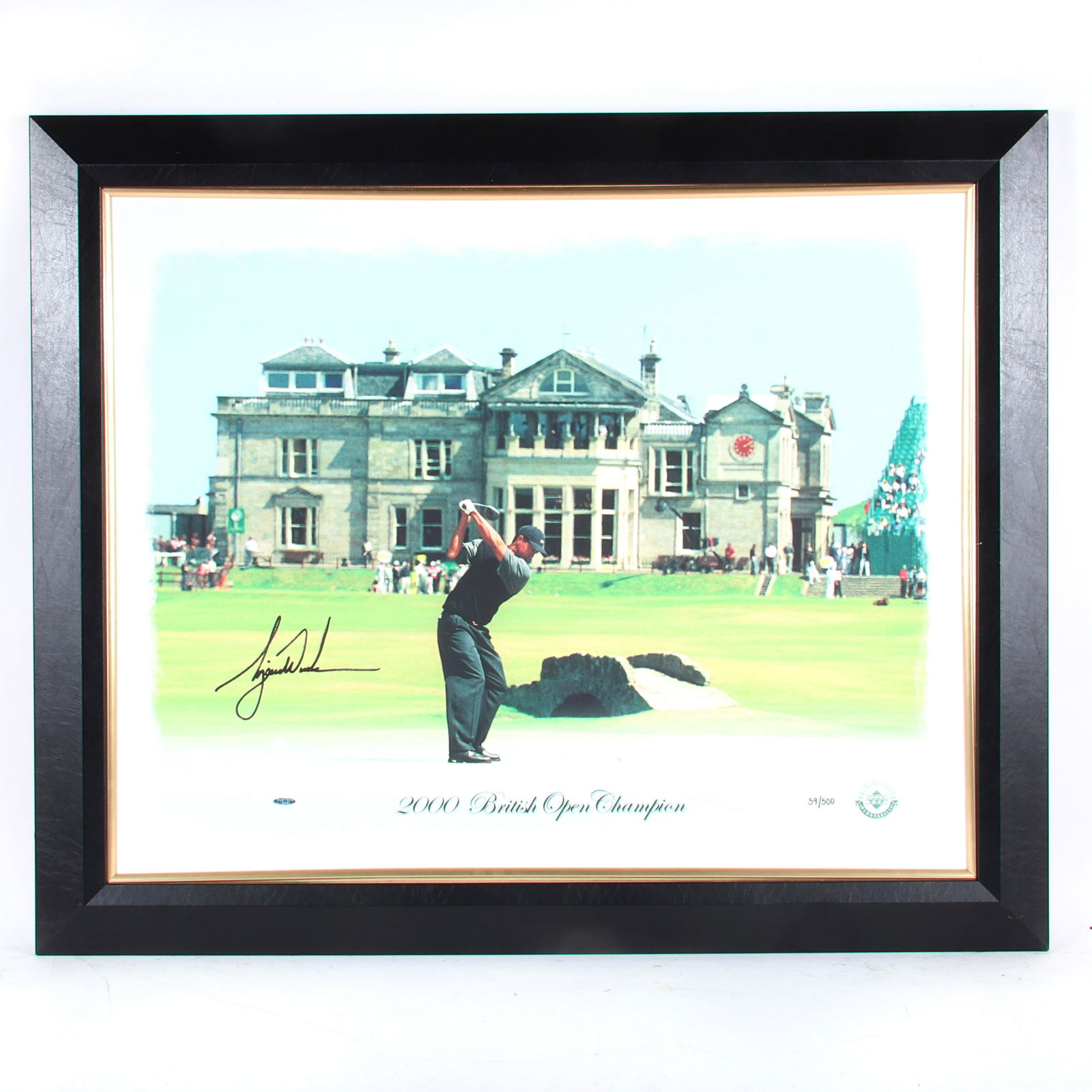 Tiger Woods Autographed British Open Canvas, UDA: This 32x40 Photo to Art piece, which highlights Tiger Woods’ victory at the 2000 British Open, was autographed by Tiger Woods. Limited Edition of 500, the UDA hologram number is BAJ11798. The backin