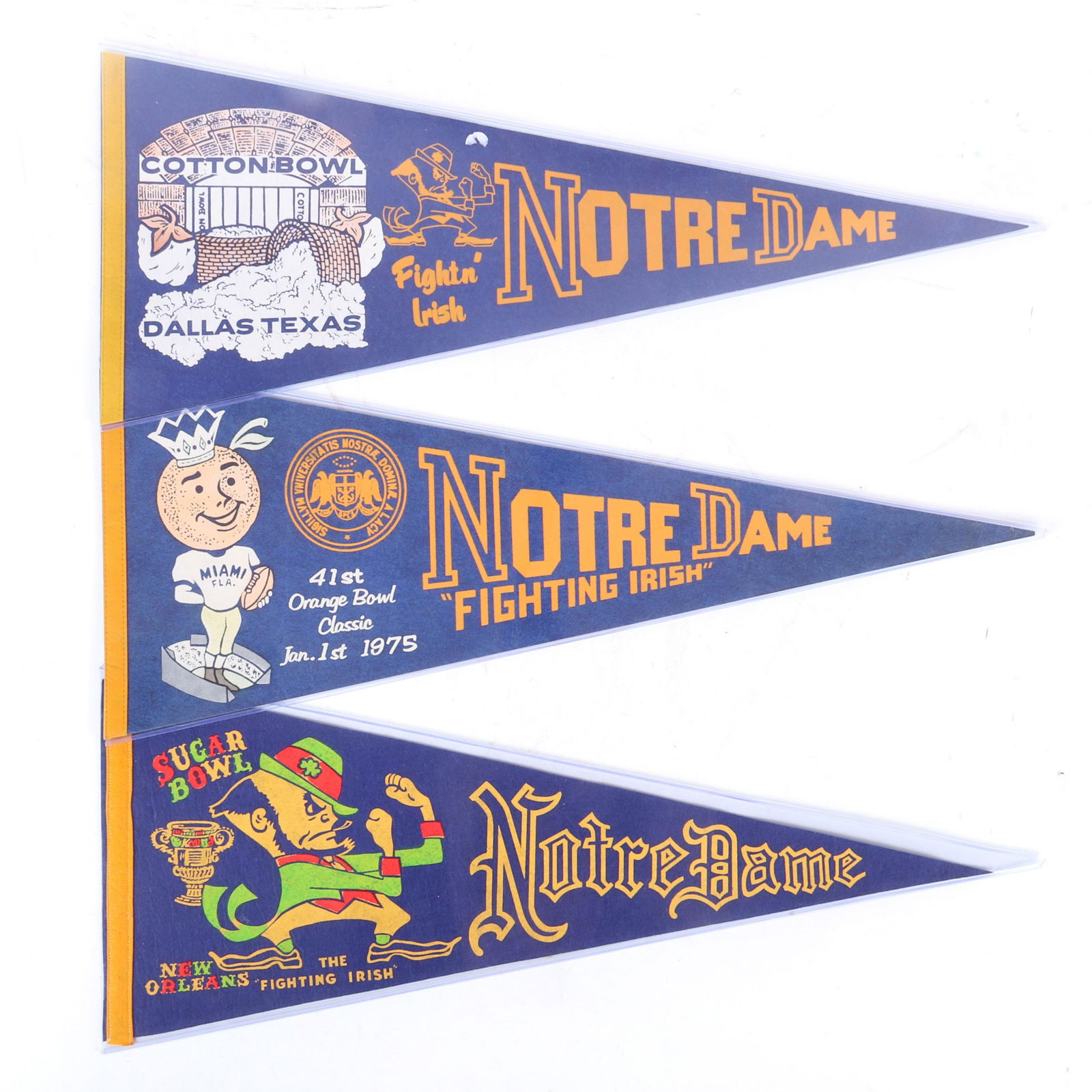 3 Vintage Notre Dame 1970's Bowl Game Pennants: 3 Vintage Pennants commemorating Notre Dame Football Bowl Games. The pennants are full sized and are from the following early to mid 1970's Notre Dame Bowl Games. Cotton Bowl, Orange Bowl, Sugar Bowl,