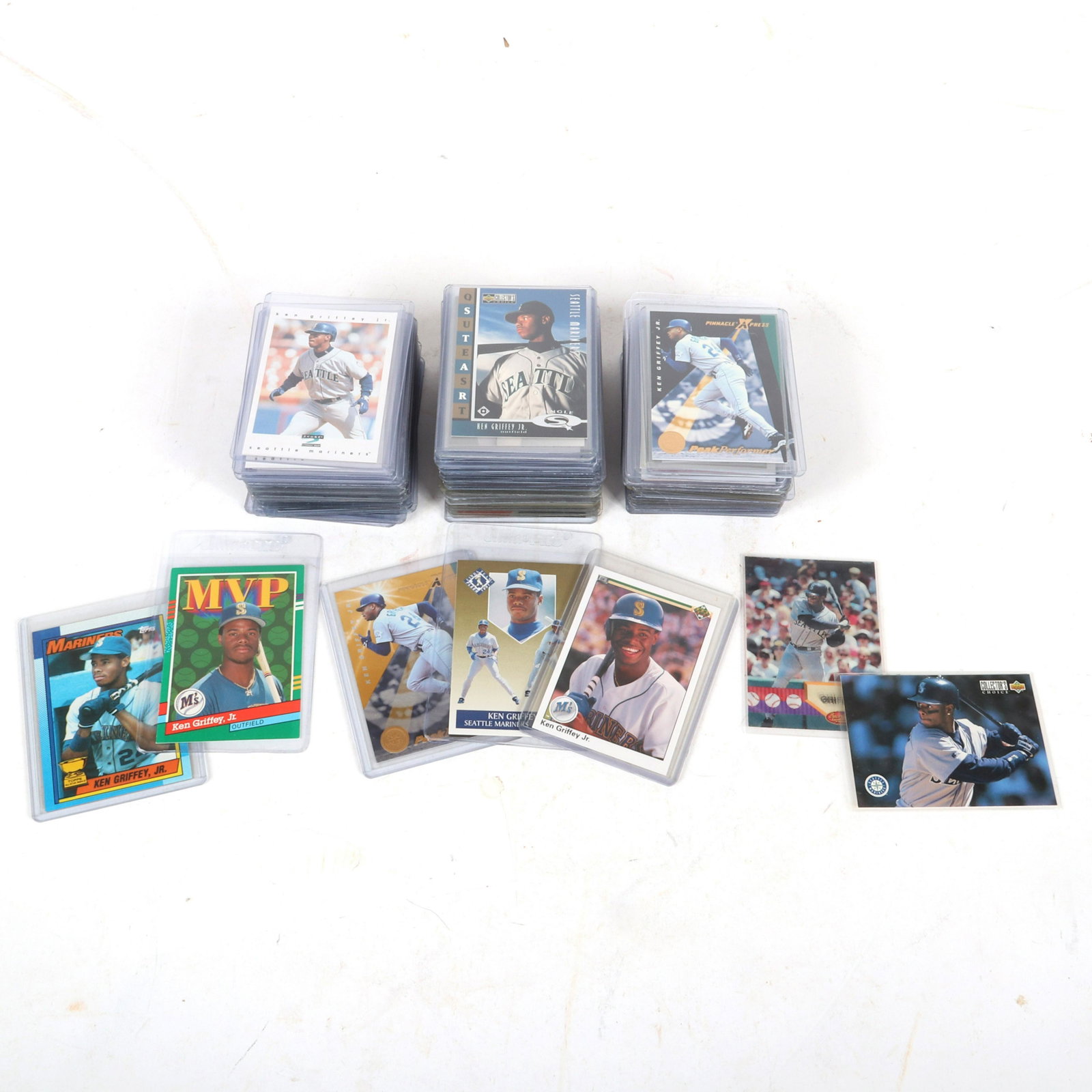 Lot of 113 Ken Griffey Jr. Baseball Cards: Large lot of Ken Griffey Jr. Baseball Cards. The lot includes 113 cards from the years 1989-2008. The lot includes the following cards: 1990 Upper Deck #156, 1991 Leaf #392, 1990 Topps #336, 7-1997 Pi