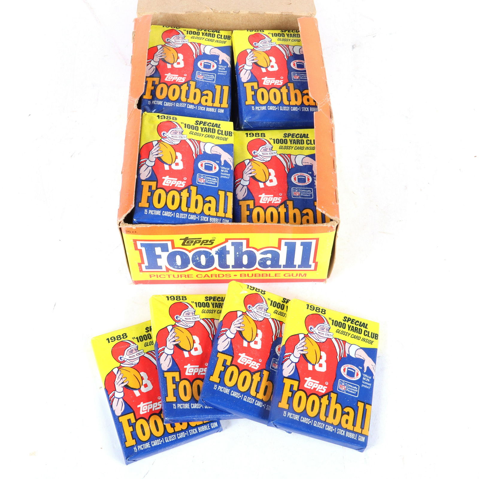1988 Topps Football Wax Box, 36 Unopened Packs: 1988 Topps Football Wax Box containing 36 Unopened Packs. The top of box has some paper loss, the packs are sealed in fantastic condition.