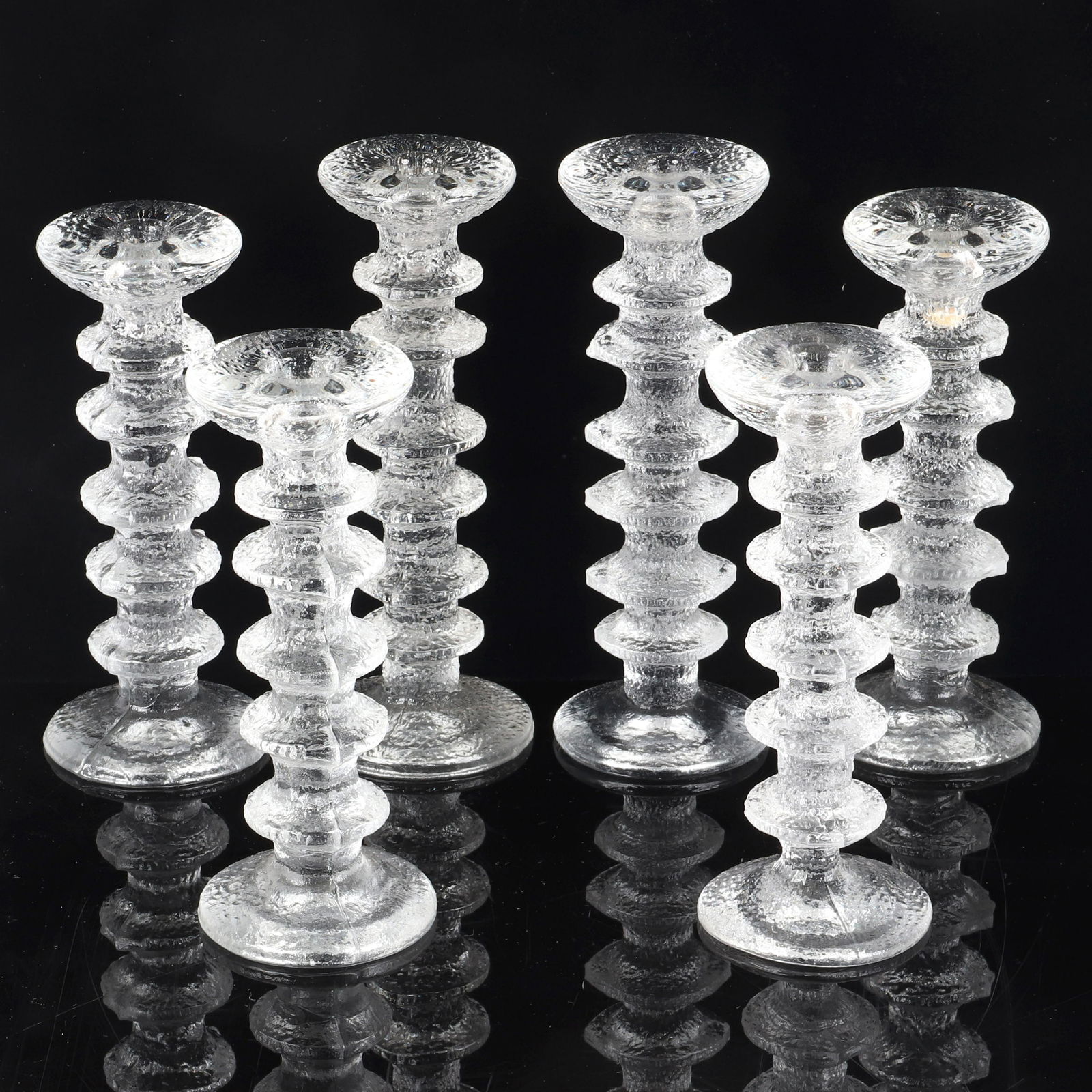 Timo Sarpaneva for Iittala Finland set of 6 cast art: Timo Sarpaneva for Iittala Finland set of 6 cast art glass 'Festivo' candlesticks, 1966. Mid Century Modern design. 9 1/2"H x 3 1/2"W