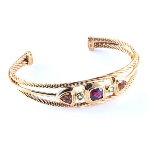 David Yurman 18K gold twisted cable cuff bracelet with: David Yurman 18K gold twisted cable cuff bracelet with bezel set semi precious gem stones - citrine, garnet, and peridot. 2 1/2"inner width, 1 1/4"opening, 18.3dwt