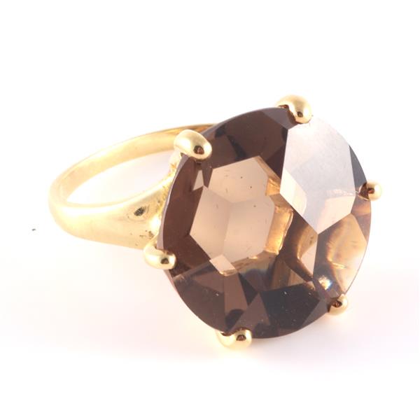 Ippolita 18K gold ring with a large faceted smoky topaz: Ippolita 18K gold ring with a large faceted smoky topaz jewel with asymmetrical cut. Ring band is bent. 7.0g. Ring size 6