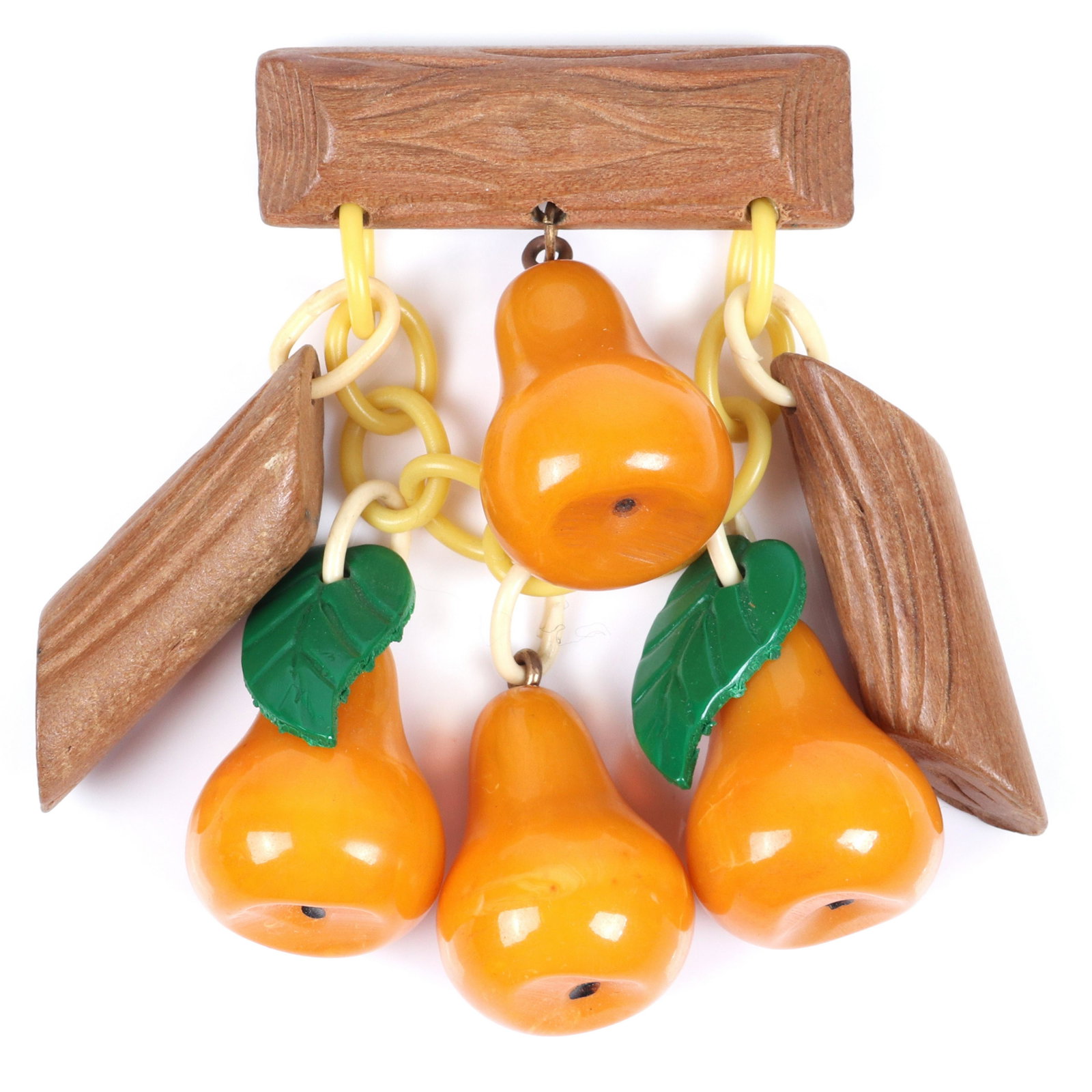 Bakelite carved butterscotch carved pear and log charm: Bakelite carved butterscotch carved pear and log charm pin brooch with celluloid chain and dangling green leaves. 2 3/4"H x 3 1/2"W