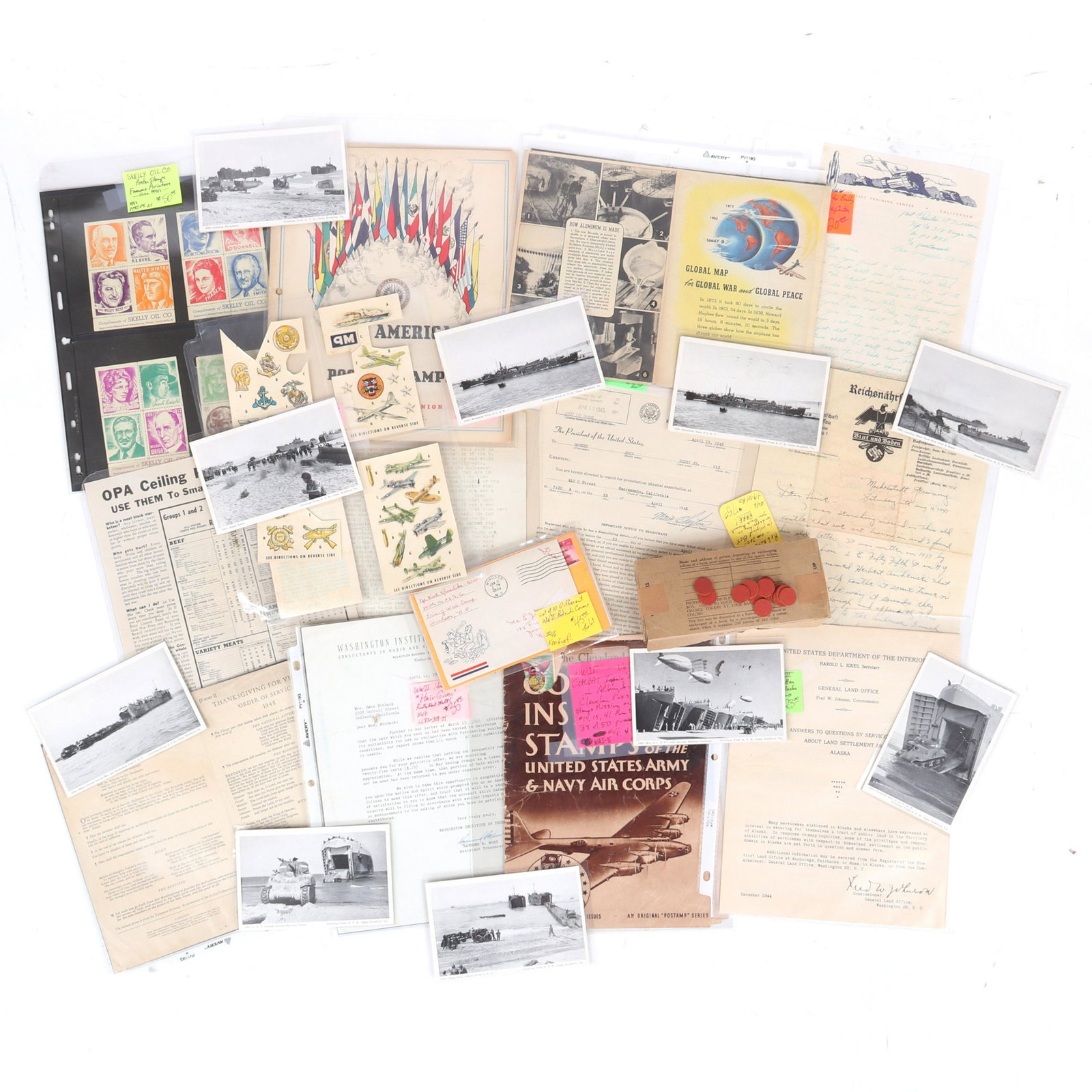 Large group WWII era memorabilia: maps & service: Large group WWII era memorabilia: maps & service emblems from Alcoa Aluminum, 200 Red Ration Tokens in original box, 10 patriotic covers, Camp Bradford training base post cards Also includes Us Depart