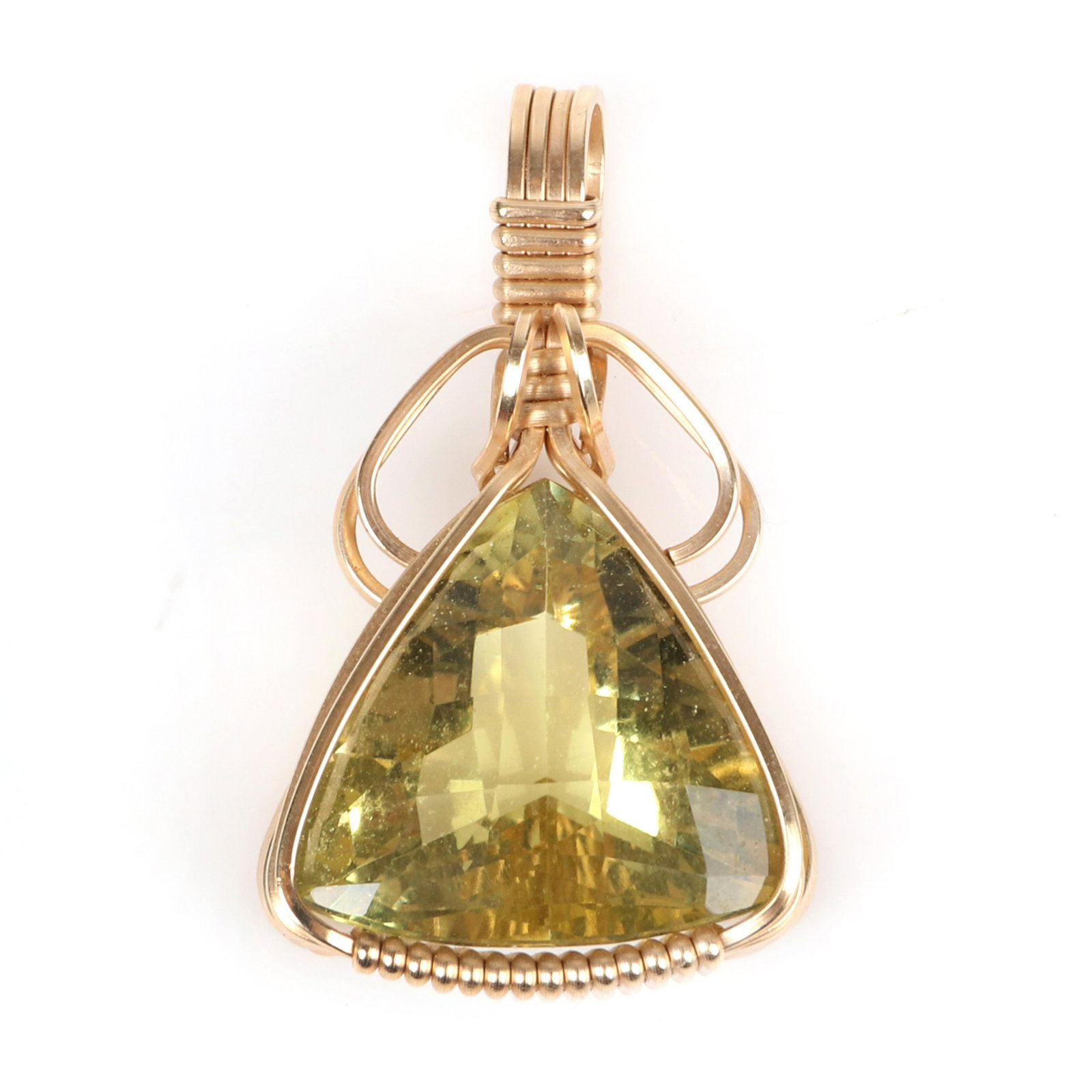 Custom rose gold wire wrapped trillion cut lemon quartz: Custom rose gold wire wrapped trillion cut lemon quartz gem stone pendant. 3.65 dwt. 1 1/4"H x 3/4"W