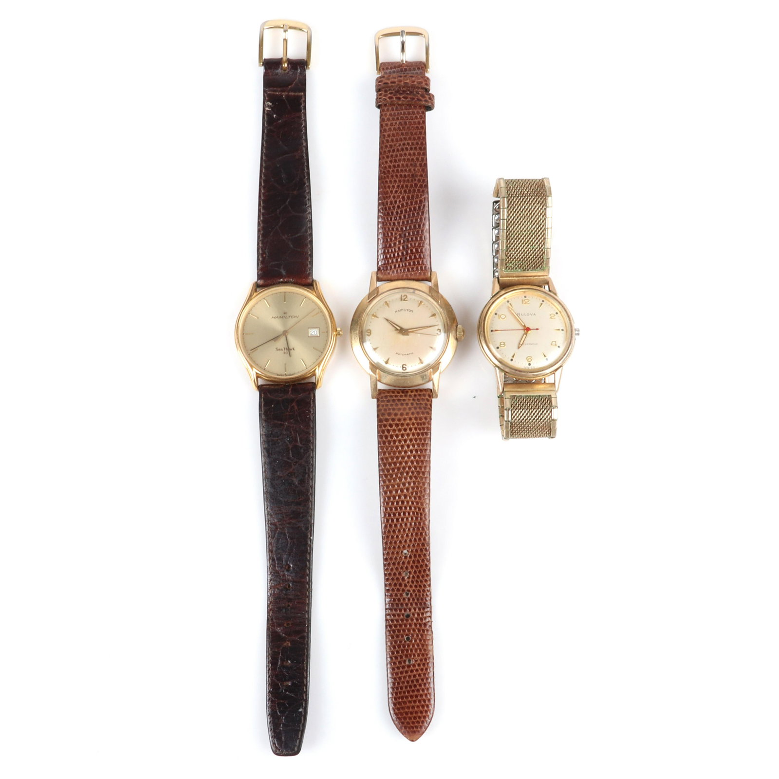 Three vintage men's watches, Hamilton Sea Hawk and: Three vintage men's watches, Hamilton Sea Hawk and Automatic with leather bands, and Bulova Waterproof with 10K rolled gold case with mesh stretch band. 9 1/4"L (longest)