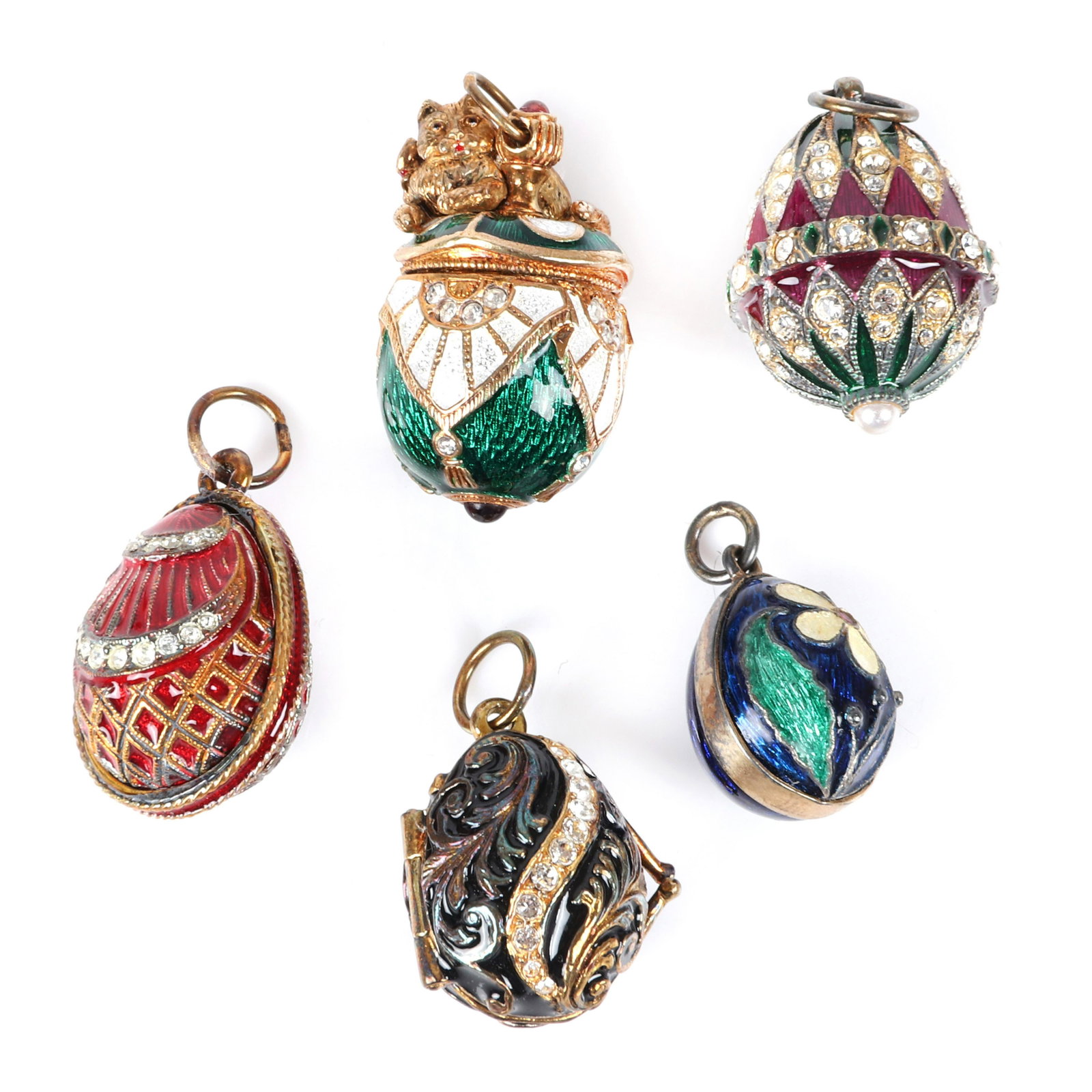 Five Russian? multi-colored enamel and rhinestone: Five Russian? multi-colored enamel and rhinestone encrusted egg shaped charm pendants including largest with figural kitten with red bow. 1 1/4"H (kitten)