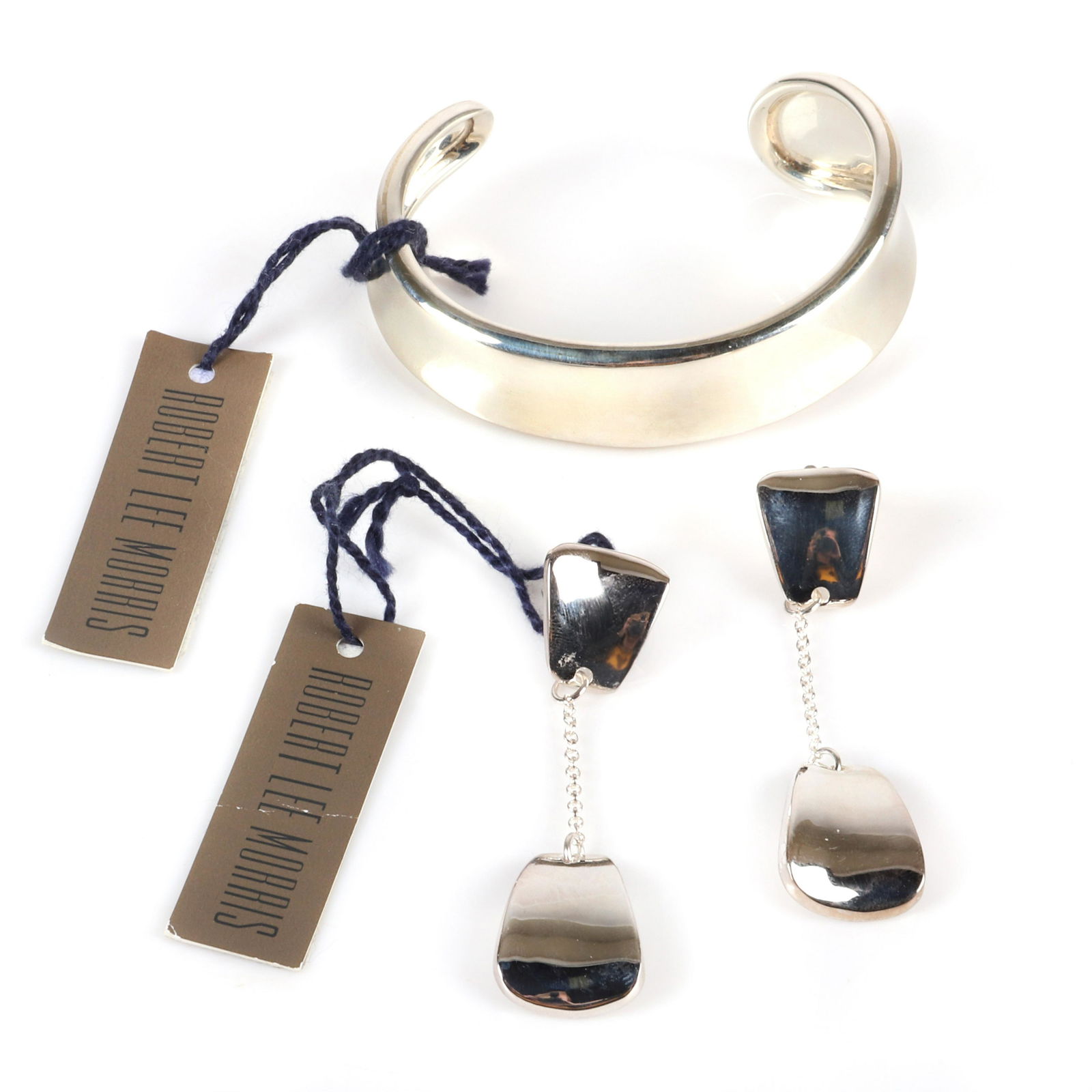 Robert Lee Morris RLM 2pc sterling silver designer: Robert Lee Morris RLM 2pc sterling silver designer group: asymmetrical cuff bracelet and hanging door knocker earrings with 14K gold hooks, marked Robert Lee Morris 925, new old stock with original ta