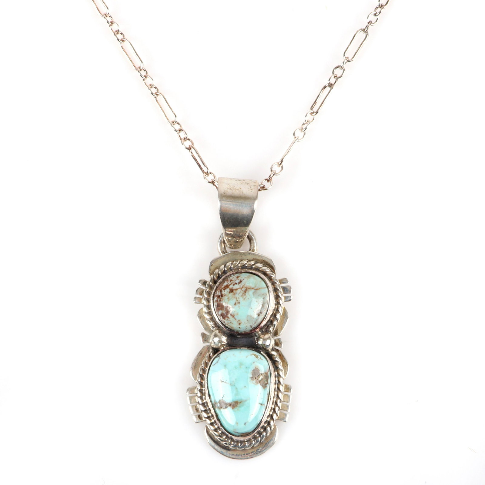 James Shay Navajo Native American Indian sterling: James Shay Navajo Native American Indian sterling silver double Kingman Turquoise pendant necklace with double link chain necklace. Marked J.S. Sterling. 1 5/8"H x 5/8"W (pendant and bail), 18"L (neck