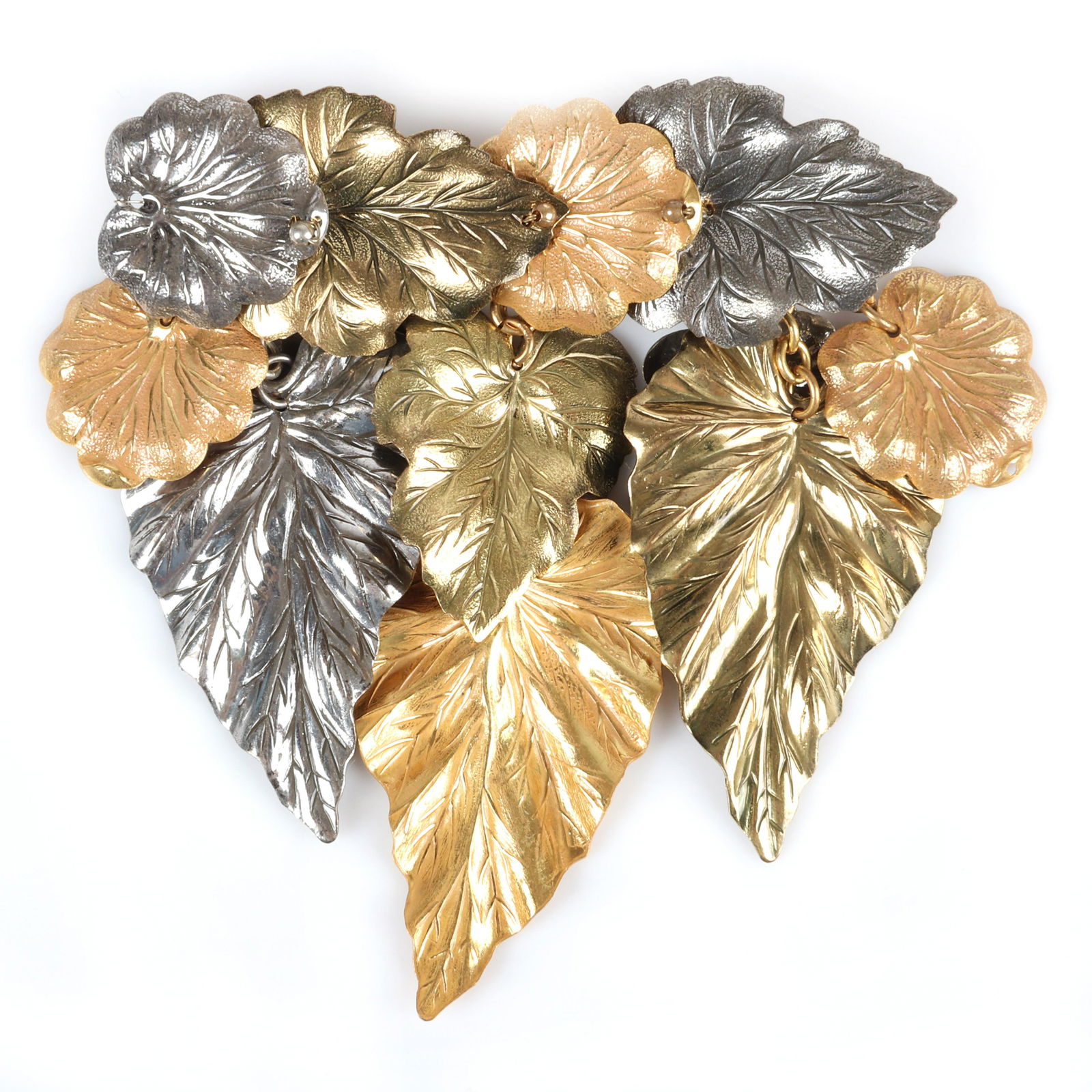 Miriam Haskell tri-color metal dangle leaf brooch 3: Miriam Haskell tri-color metal dangle leaf brooch with various sizes and tones of gold and silver leaves layered and suspended from chains. 3 1/4" H x 3 1/2" W