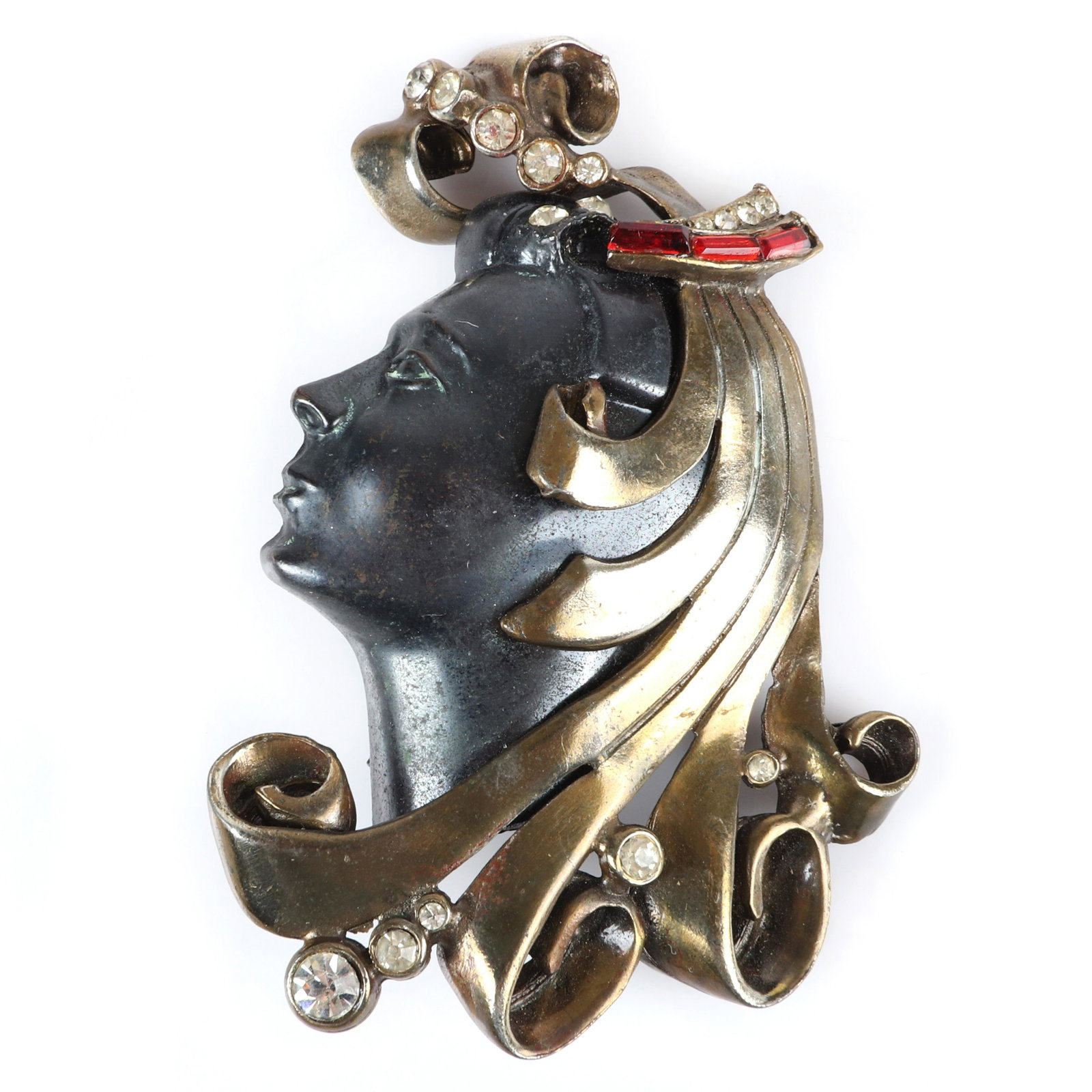 Unsigned 1941 Black Starr & Gorham glamour head pin: Unsigned 1941 Black Starr & Gorham glamour head pin brooch. Exotic woman with black metal face and flowing gold washed locks decorated with ruby crystal baguettes and bezel-set rhinestones. Brunialti,